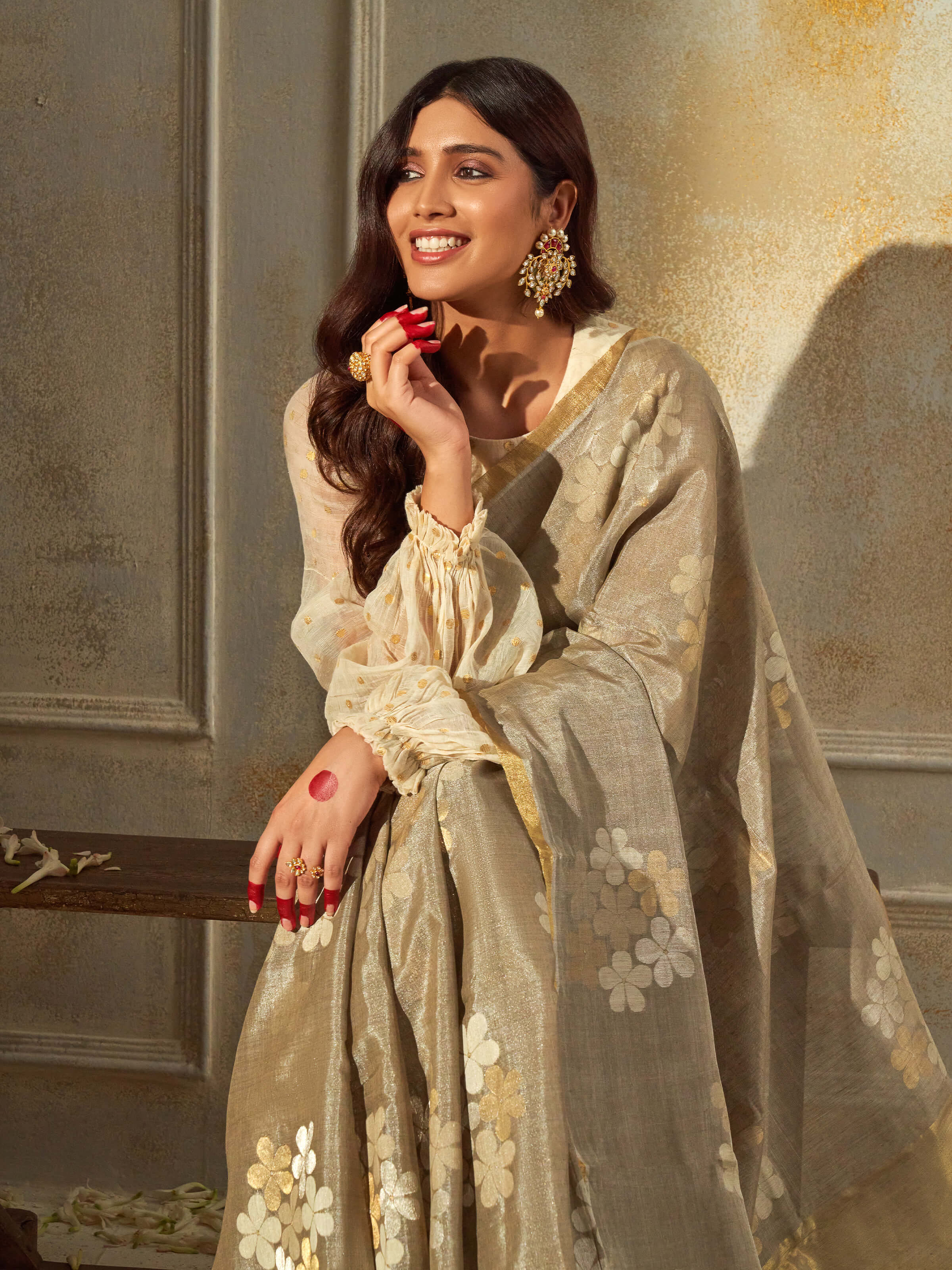 Angled view of grey tussar silk saree highlighting sheen and weave