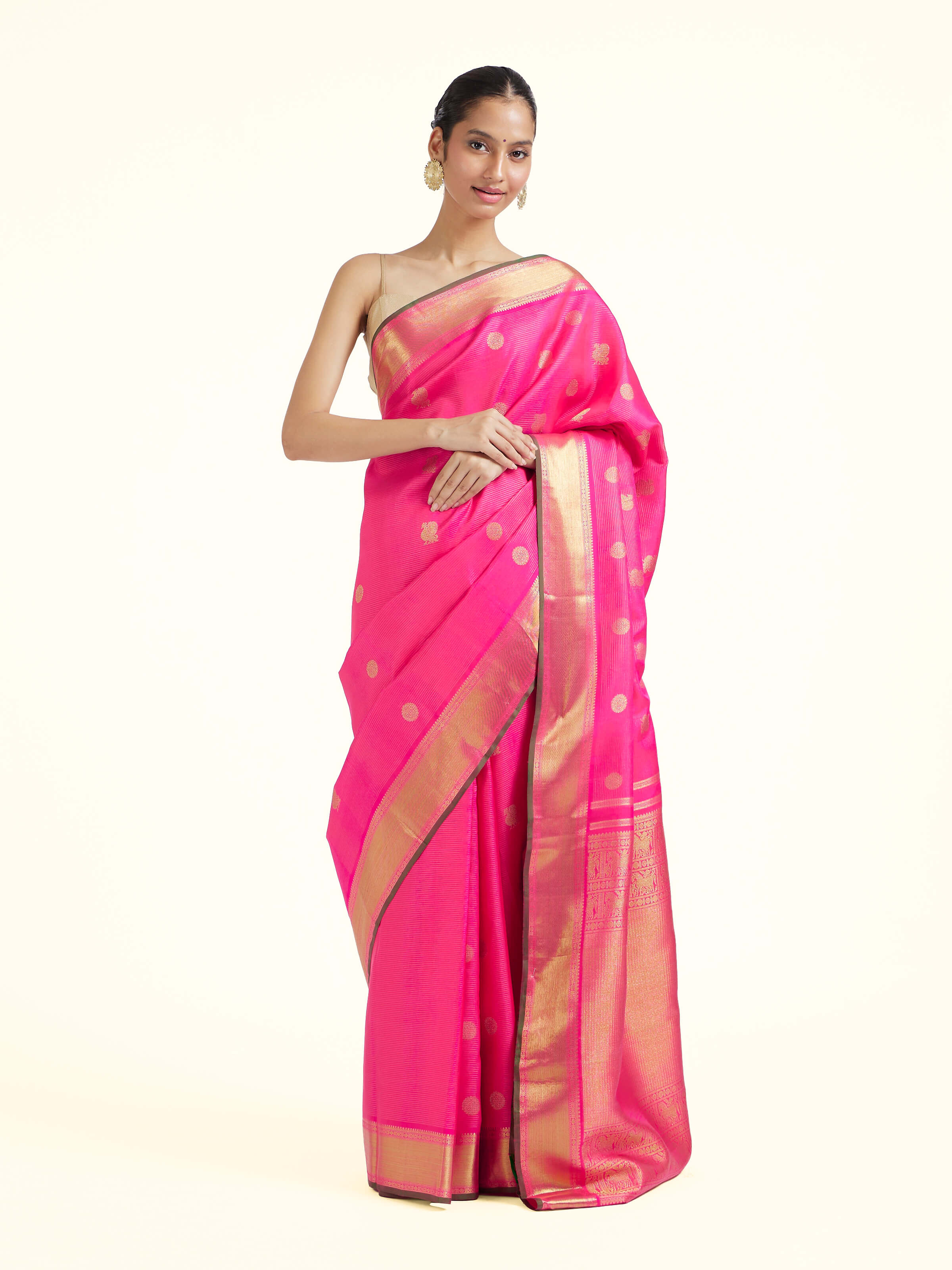 Front view of pink silk Kancheepuram saree with rich zari woven motifs