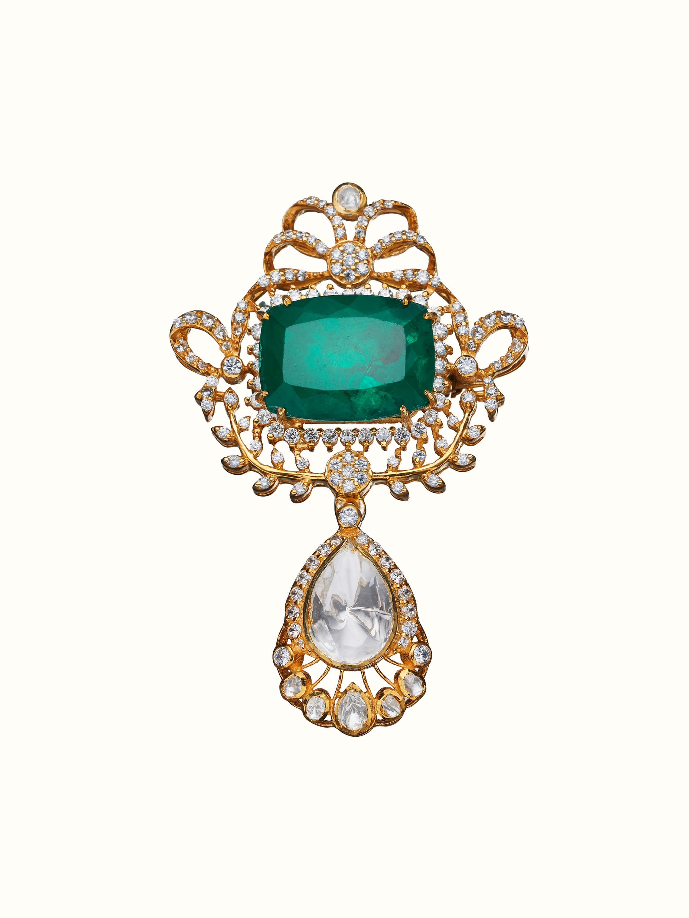 front view of silver smithing yellow gold brooch pin with intricate design