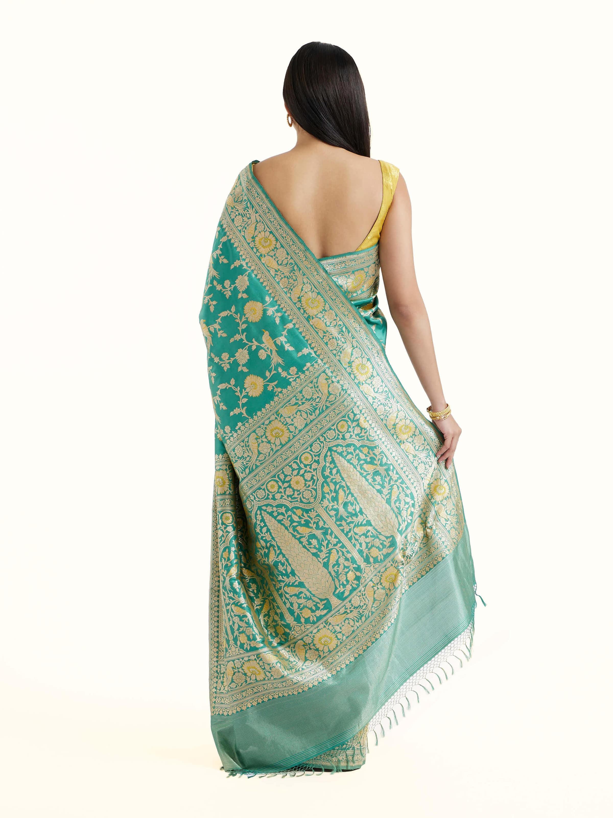 Back view of sea blue mulberry katan silk Banarasi saree displaying ornate pallu design