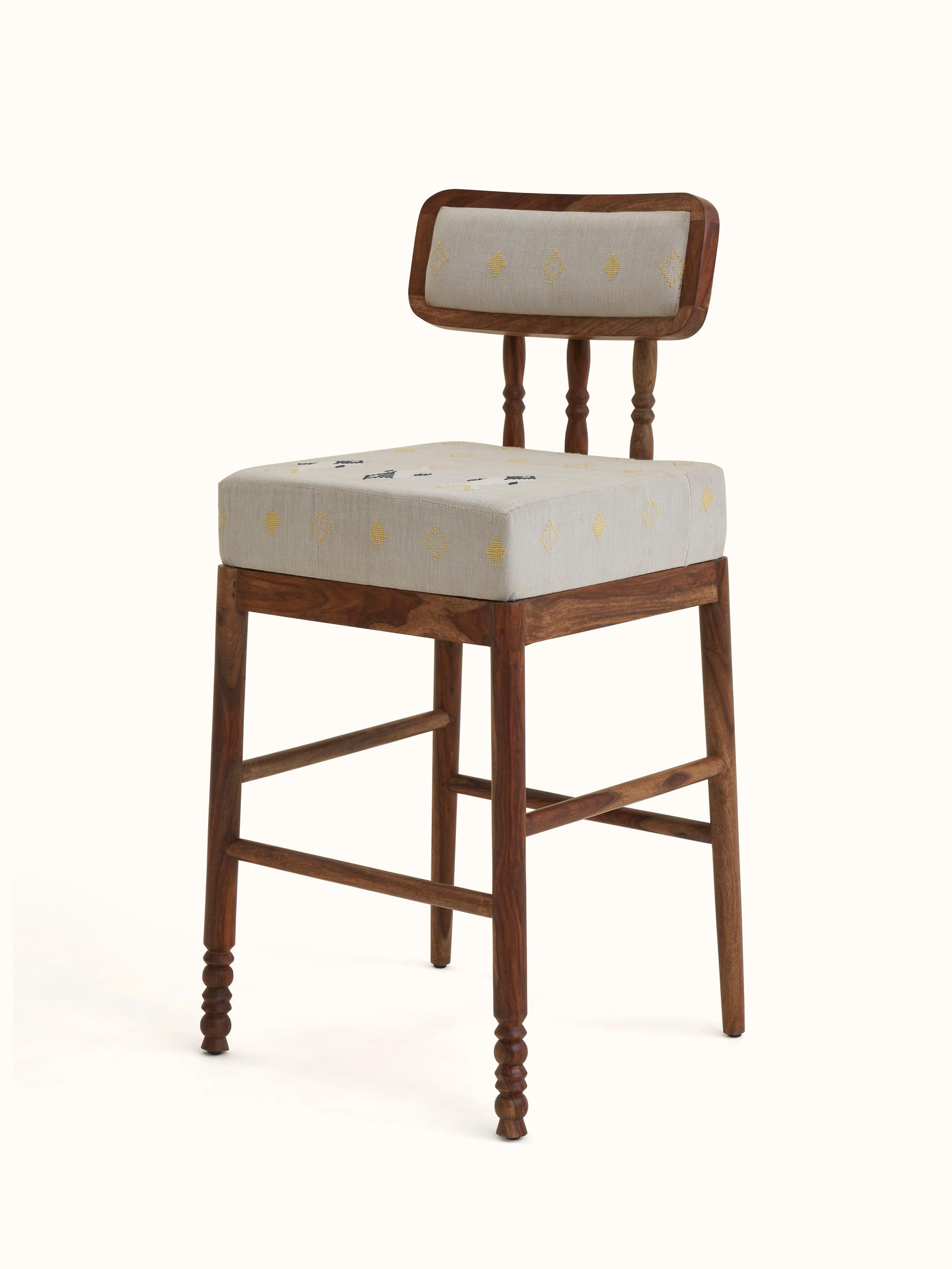 Angled view of Upholstered Sheesham Wood Bawan Buti Bar Stool focusing on design details