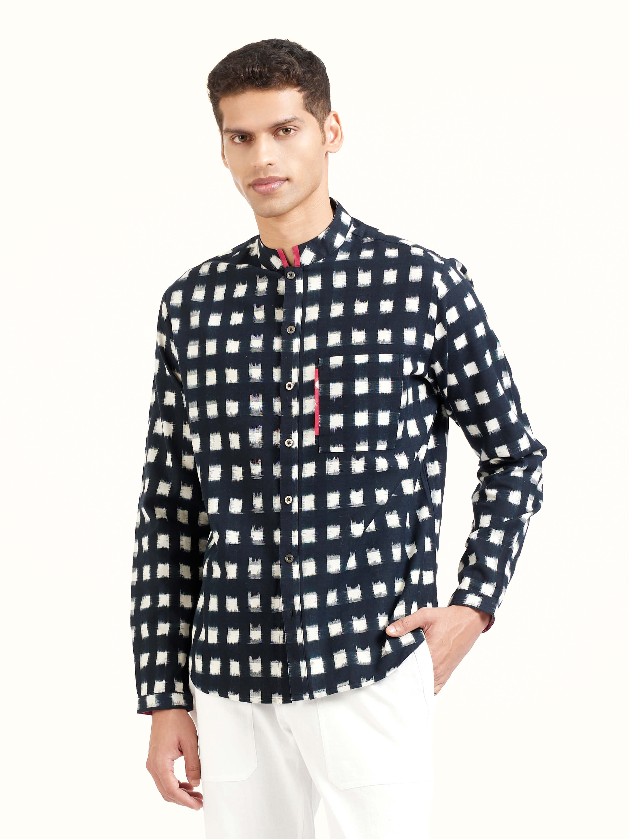 Angled view of black cotton Telangana Ikat shirt highlighting Ikat weaving technique