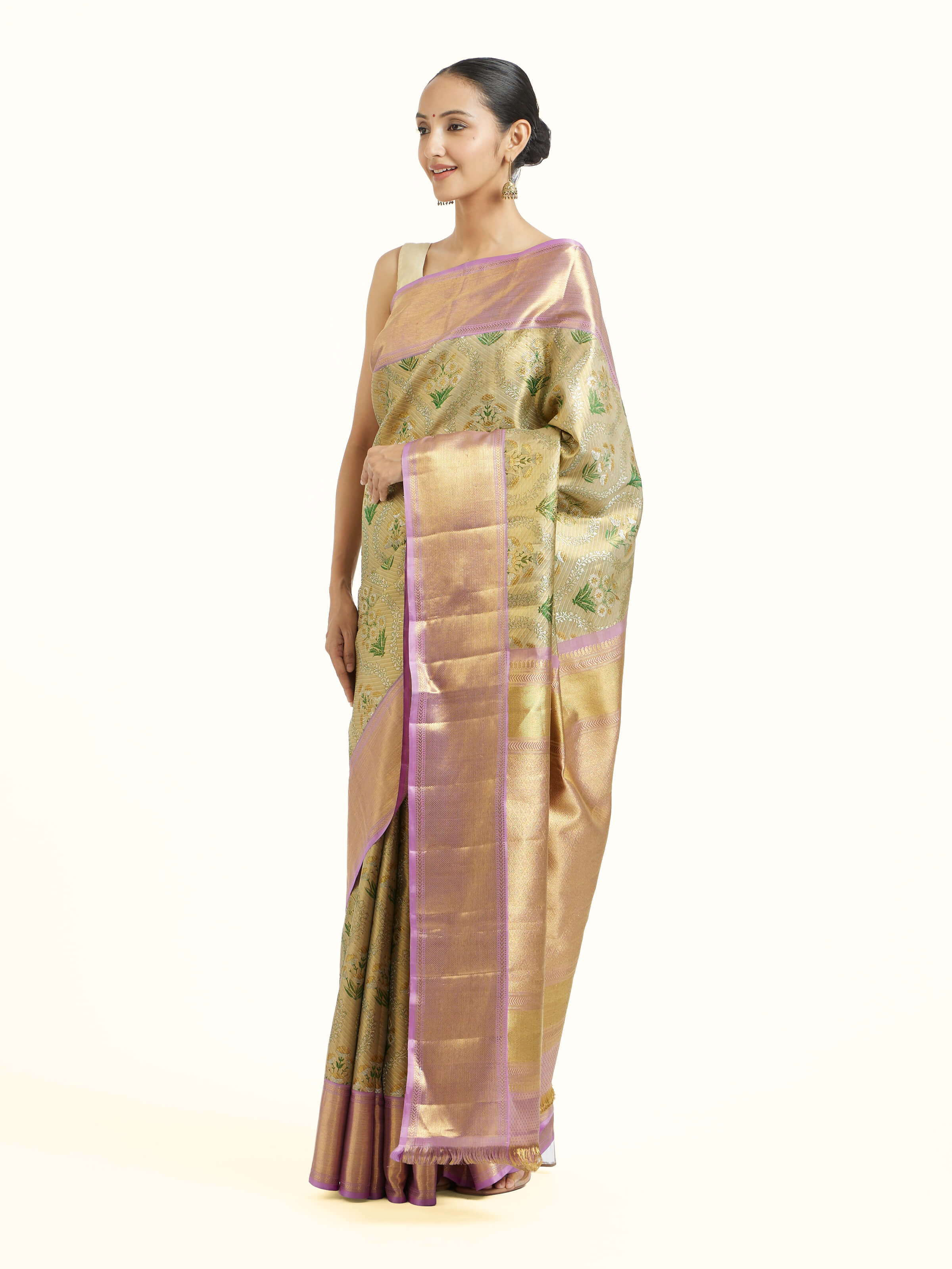 Side view of gold silk Kancheepuram saree showcasing elegant drape