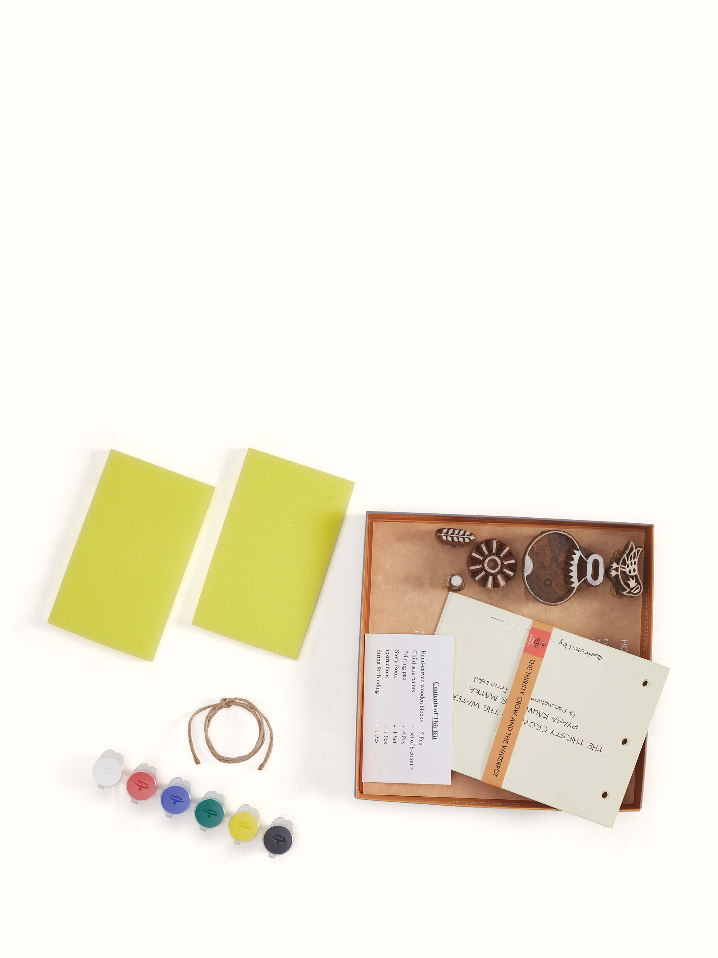 Detailed view of Block-making DIY your own story painting kit in green focusing on the blocks and painting supplies