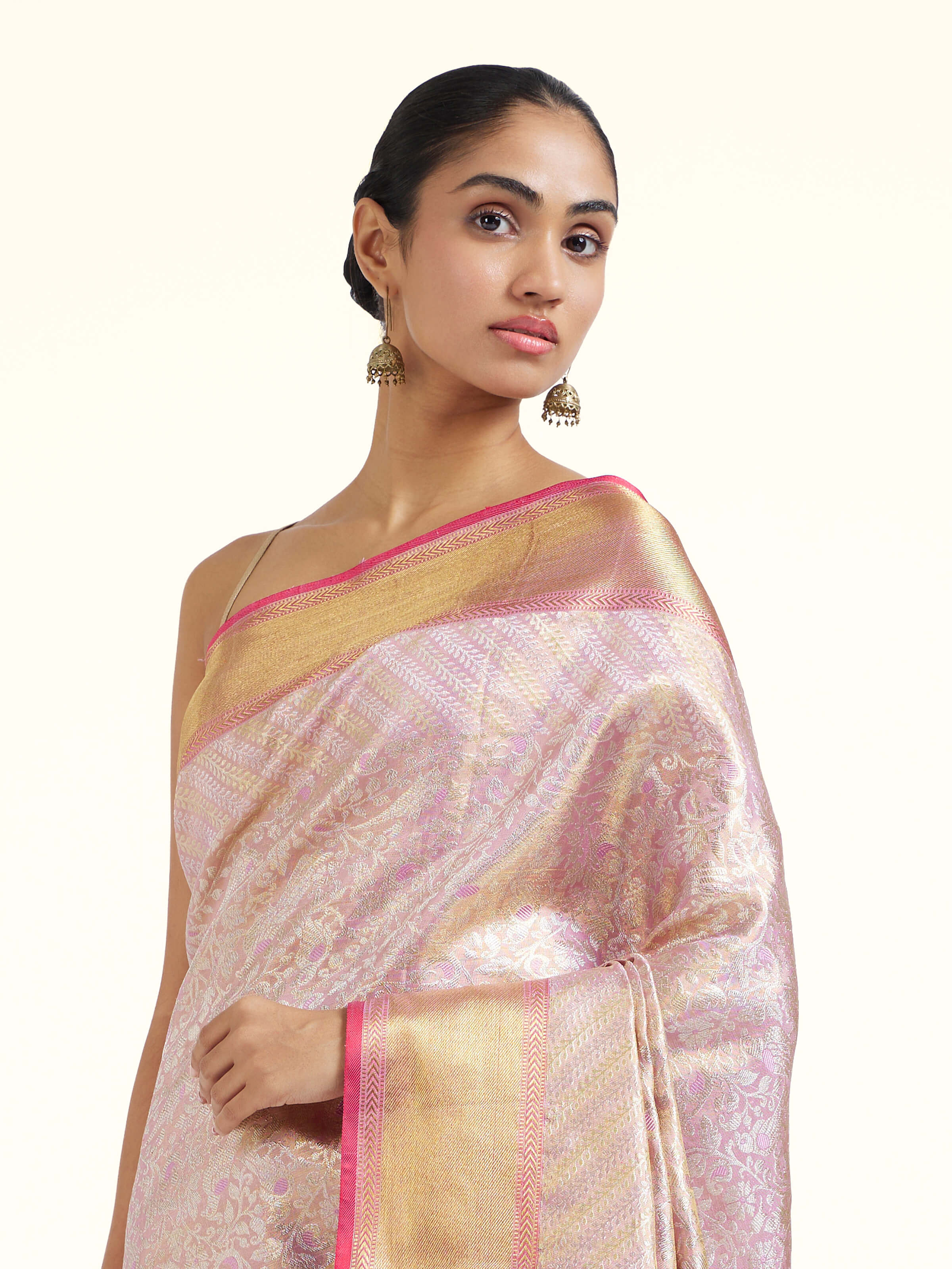 Angled view of mauve silk Kancheepuram saree highlighting woven motifs