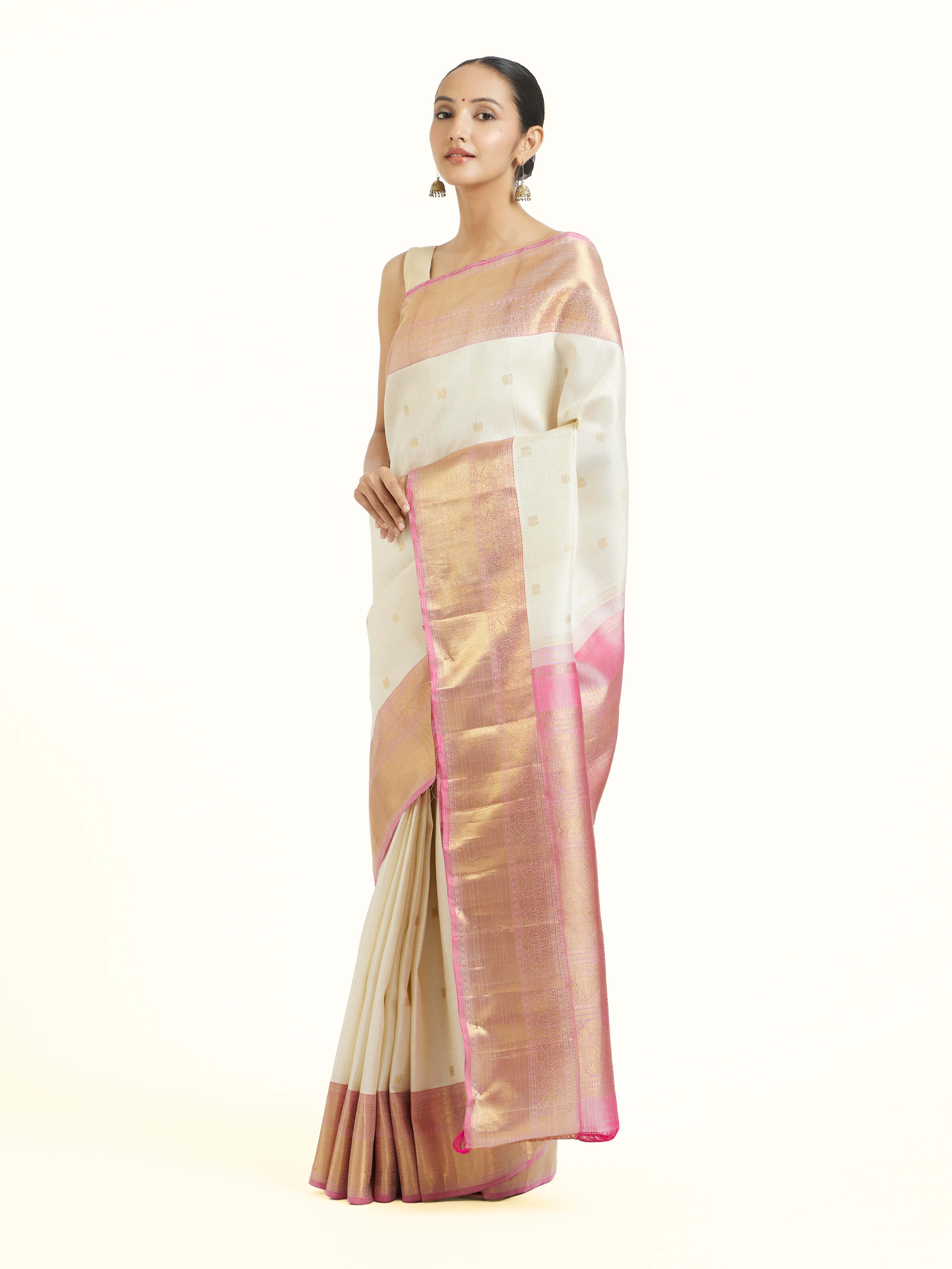 Side view of off-white silk Kancheepuram saree with elegant drape