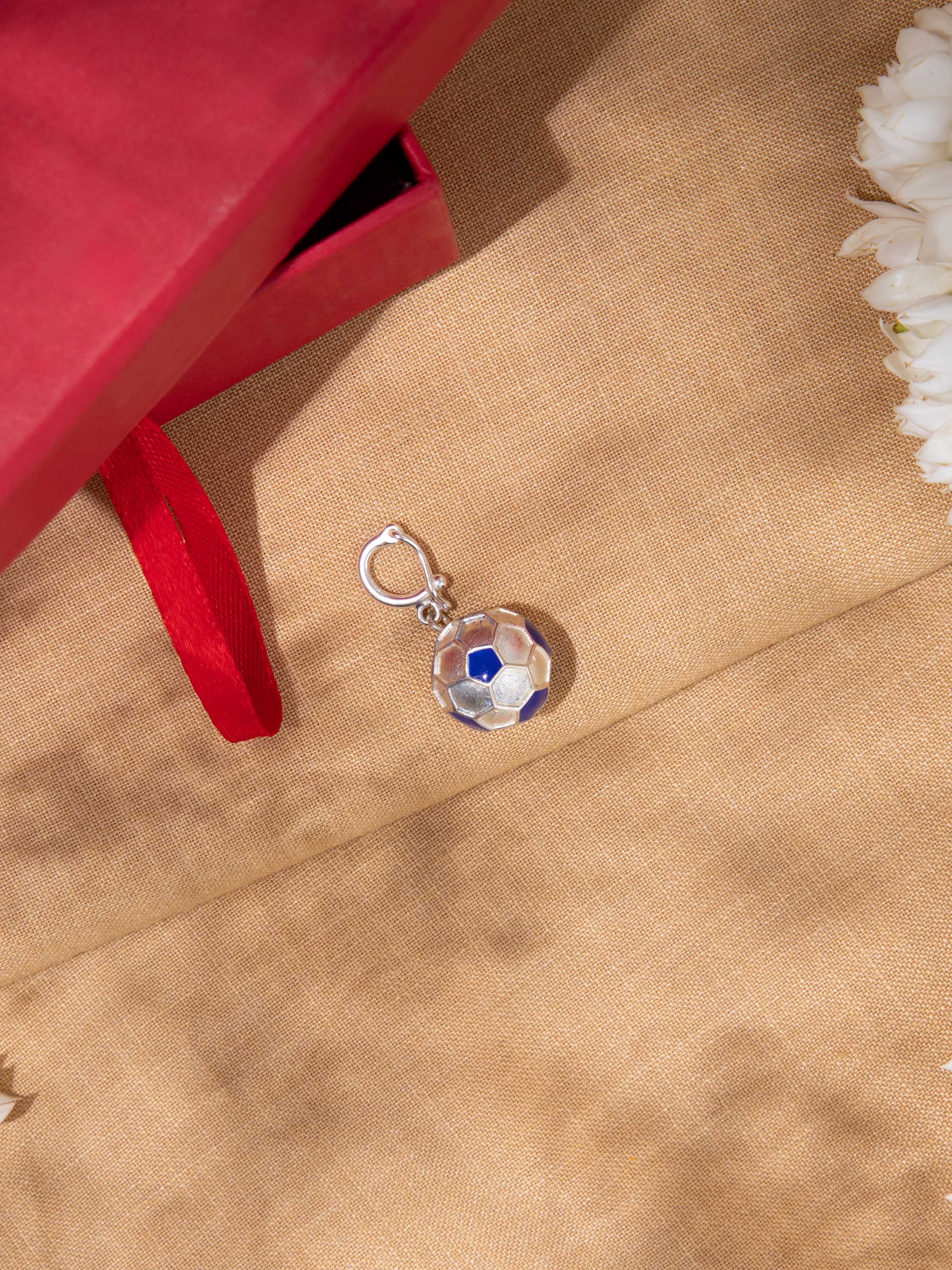 Woman wearing silver smithing pendant paired with earthy-toned outfit, highlighting rustic elegance.