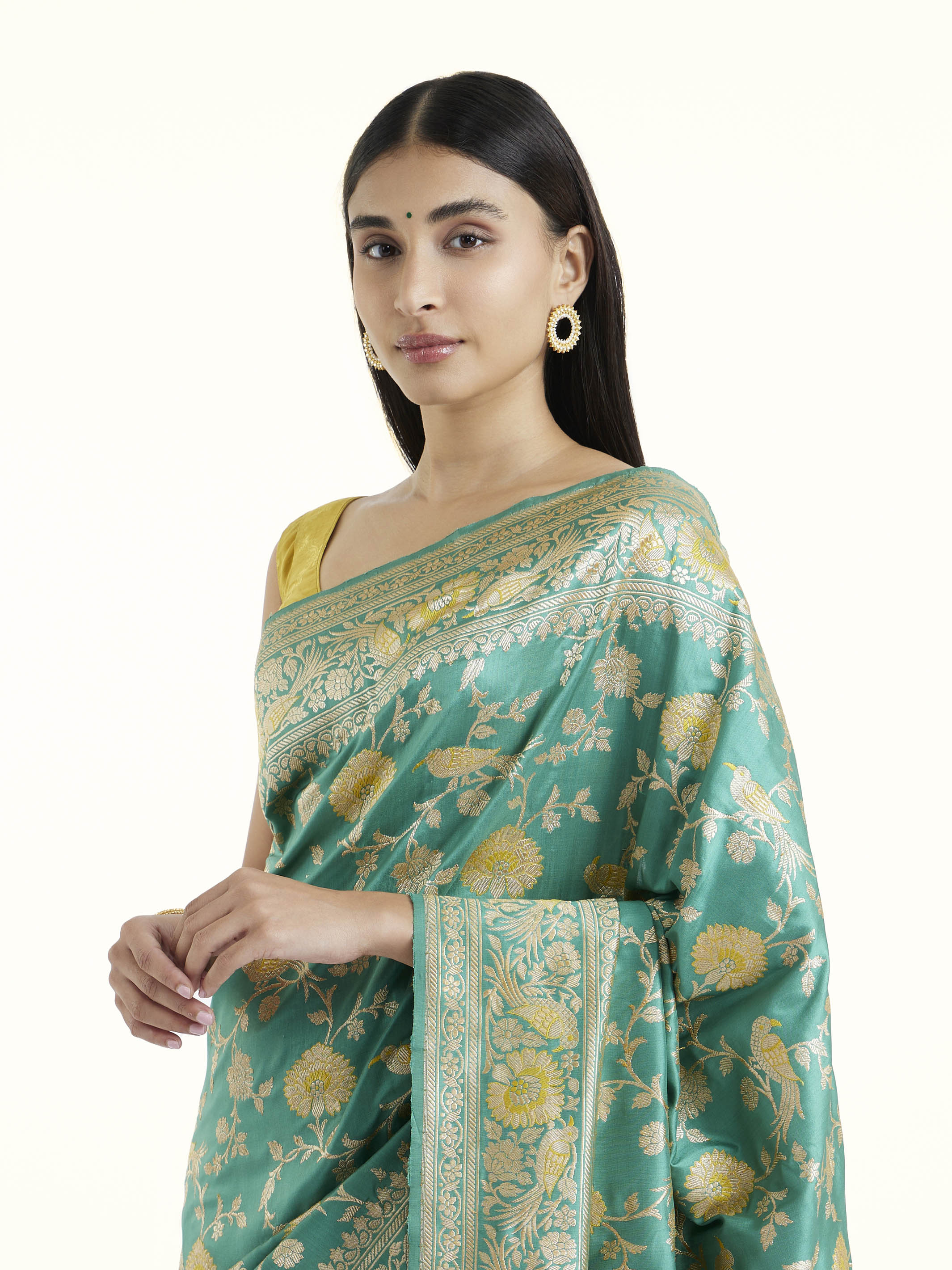 Angled view of sea blue mulberry katan silk Banarasi saree highlighting traditional weave and sheen