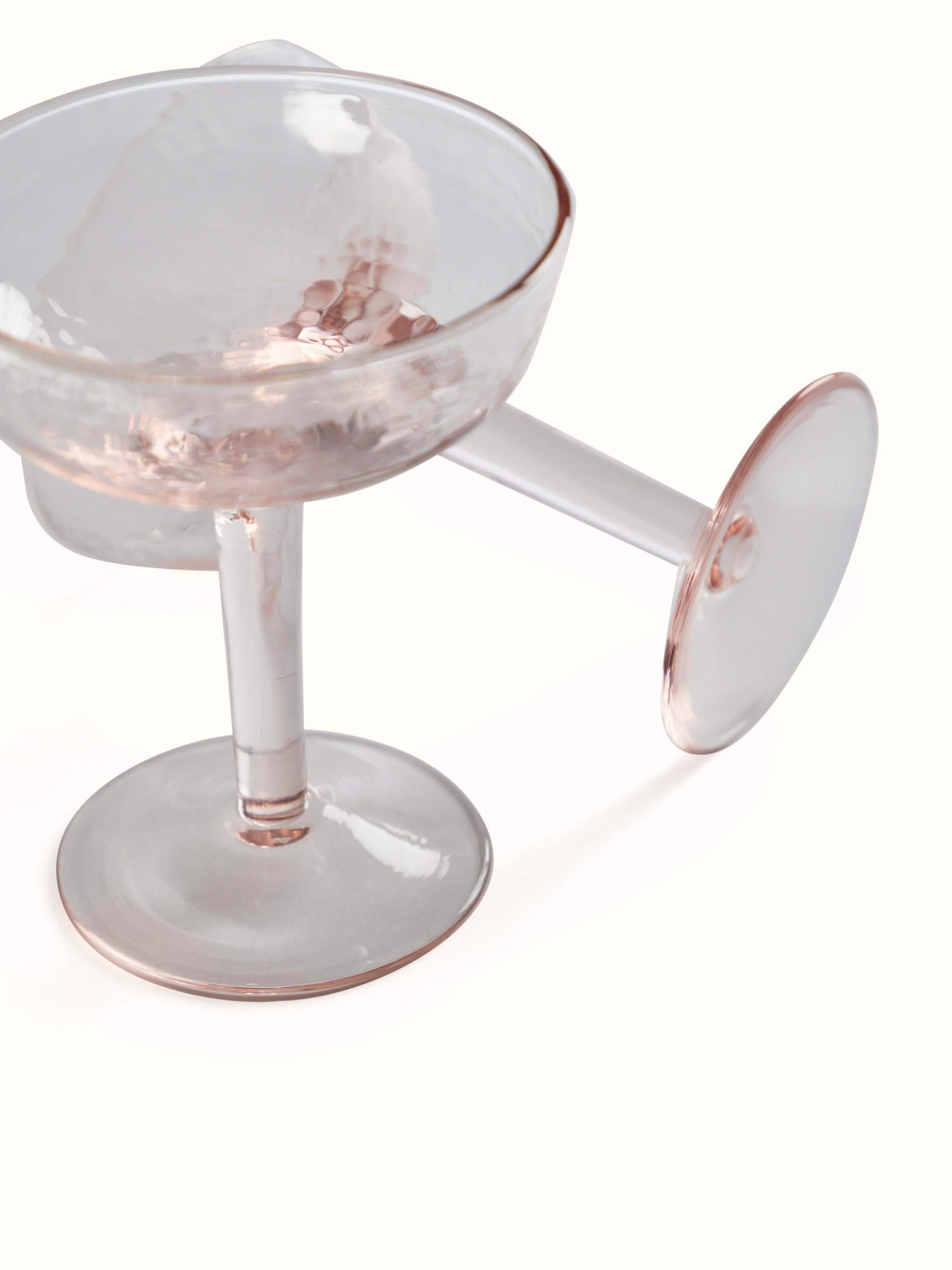 Close-up detail of Glass-worked Wine Glasses in pink focusing on the glass texture and design elements.