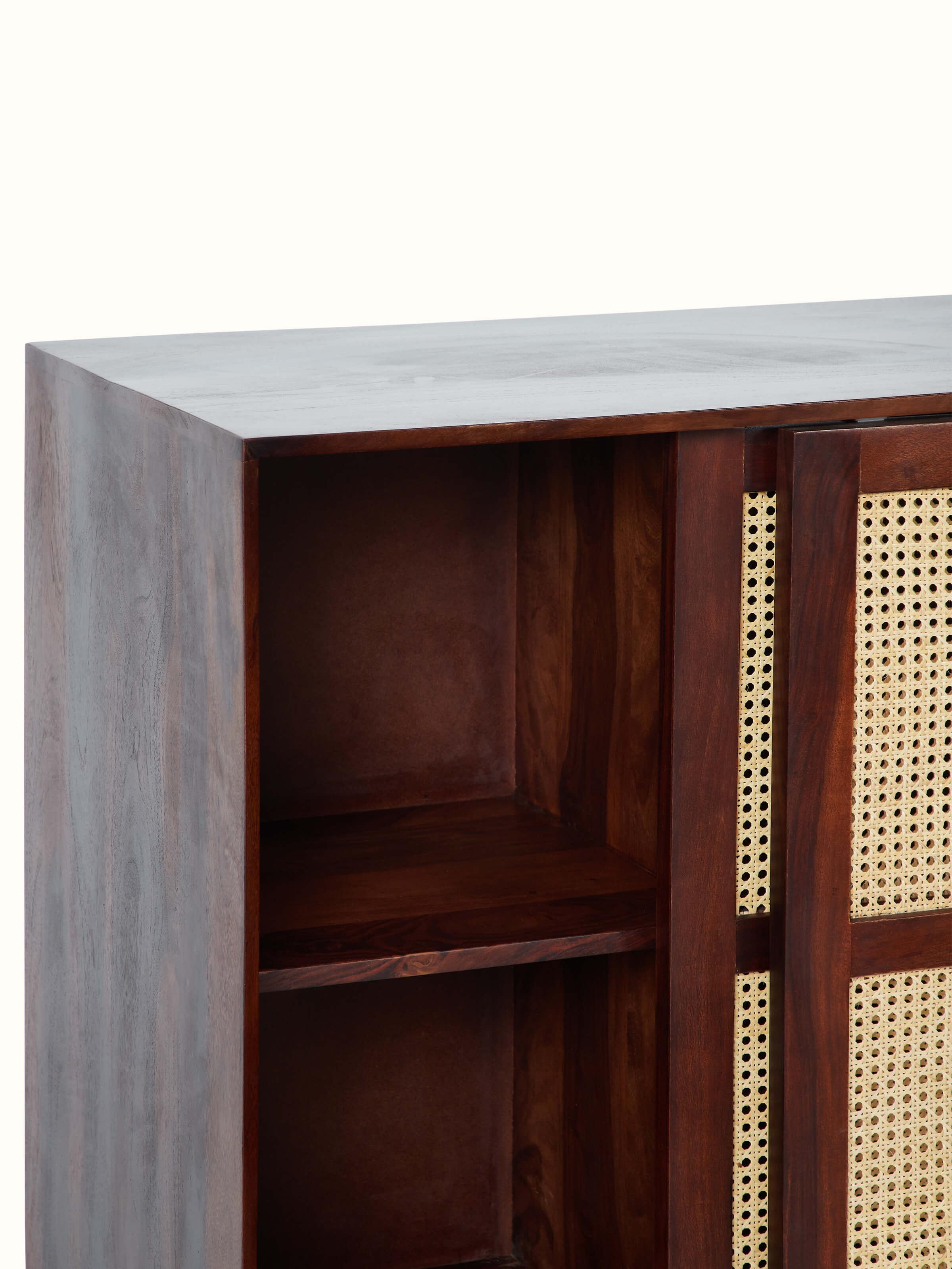 Angle view of the Sheesham wood and cane bar cabinet, showcasing the design and functionality of the cabinet.