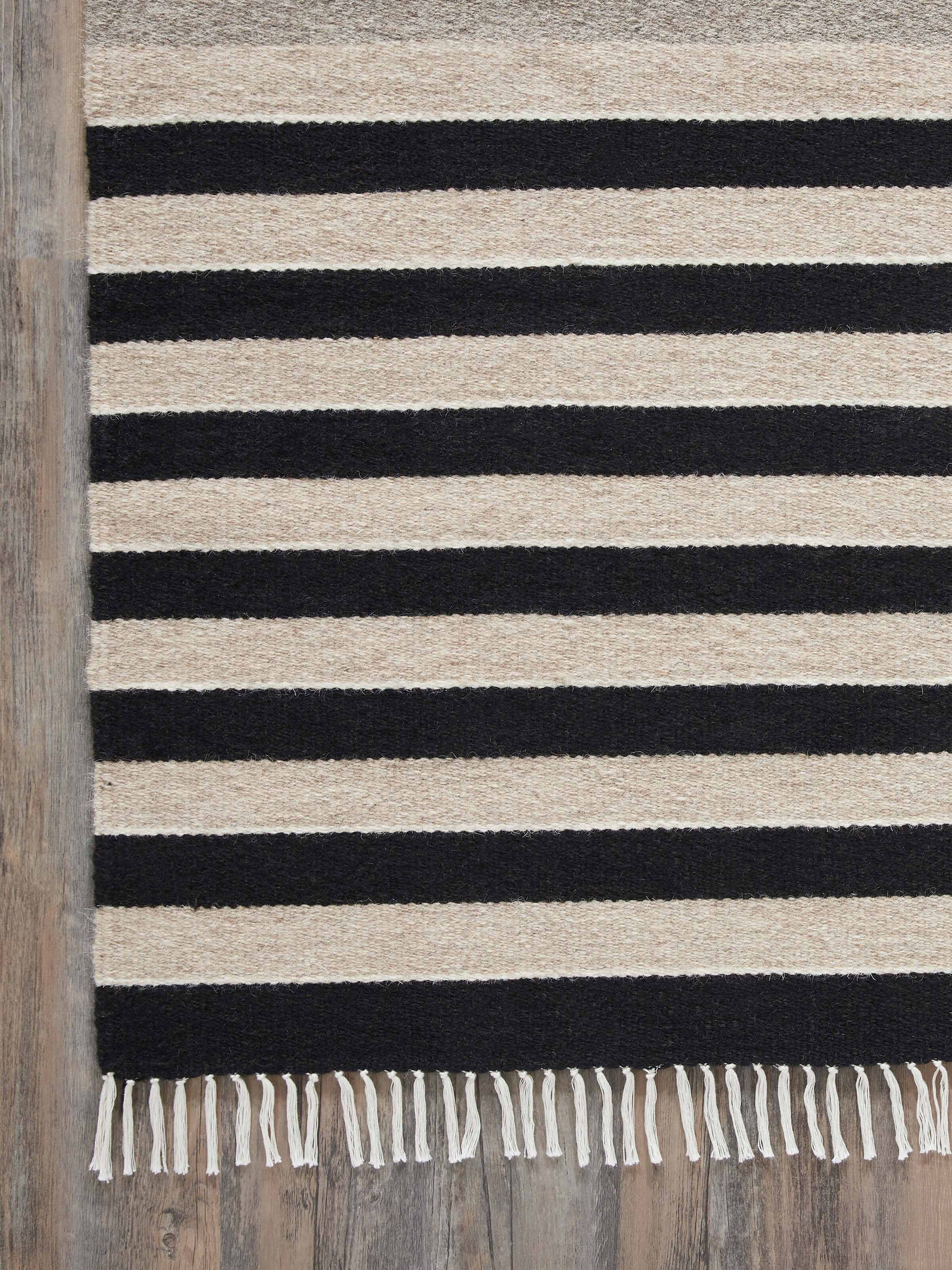 Detailed view of Nomad Stripes Black Beige Jawaja Wool & Cotton Handloom Dhurrie (3x5 ft) focusing on the wool and cotton blend and stripe pattern