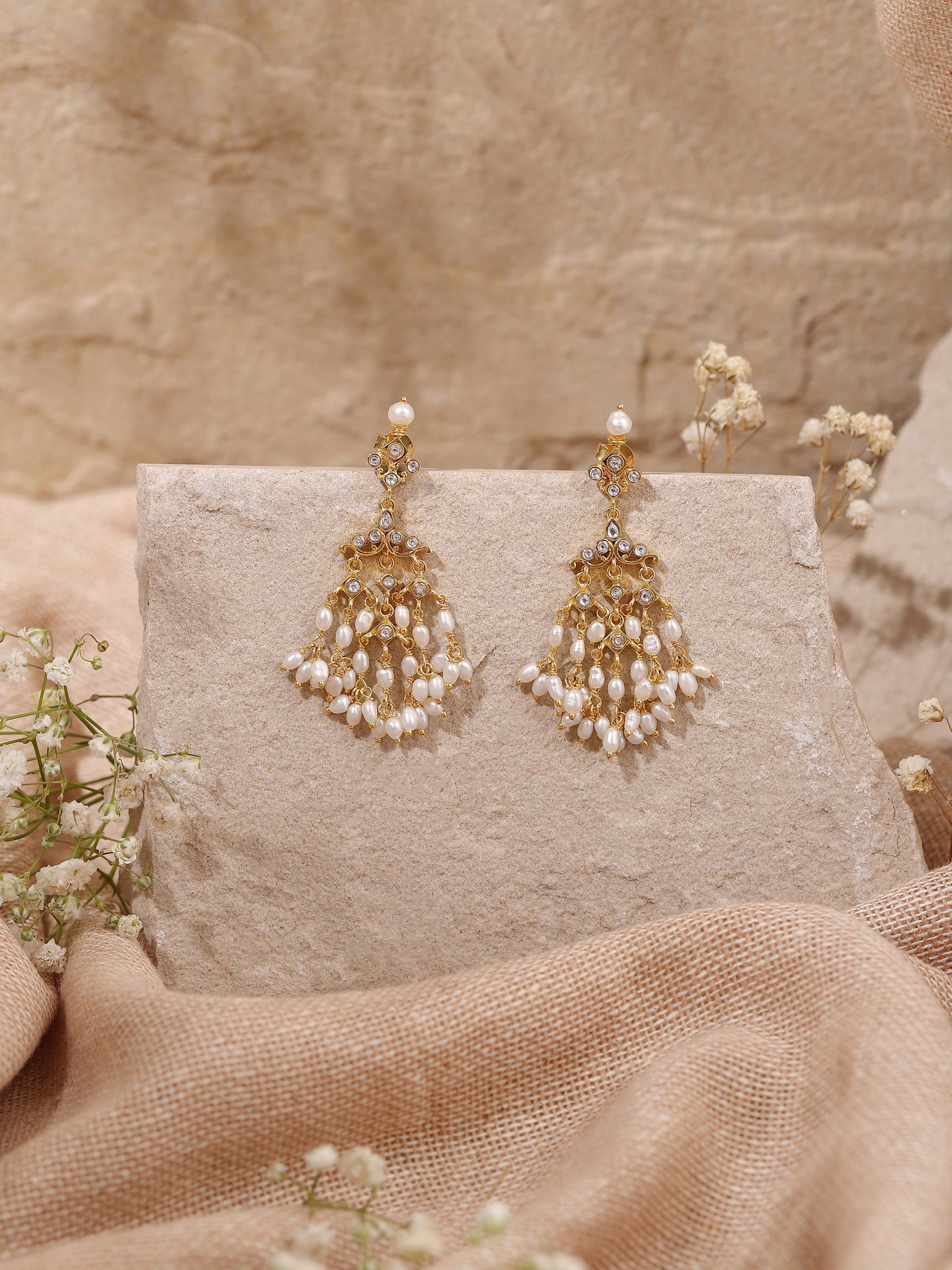 Lifestyle view presenting the earrings styled with festive wear, enhancing the richness and antique look.