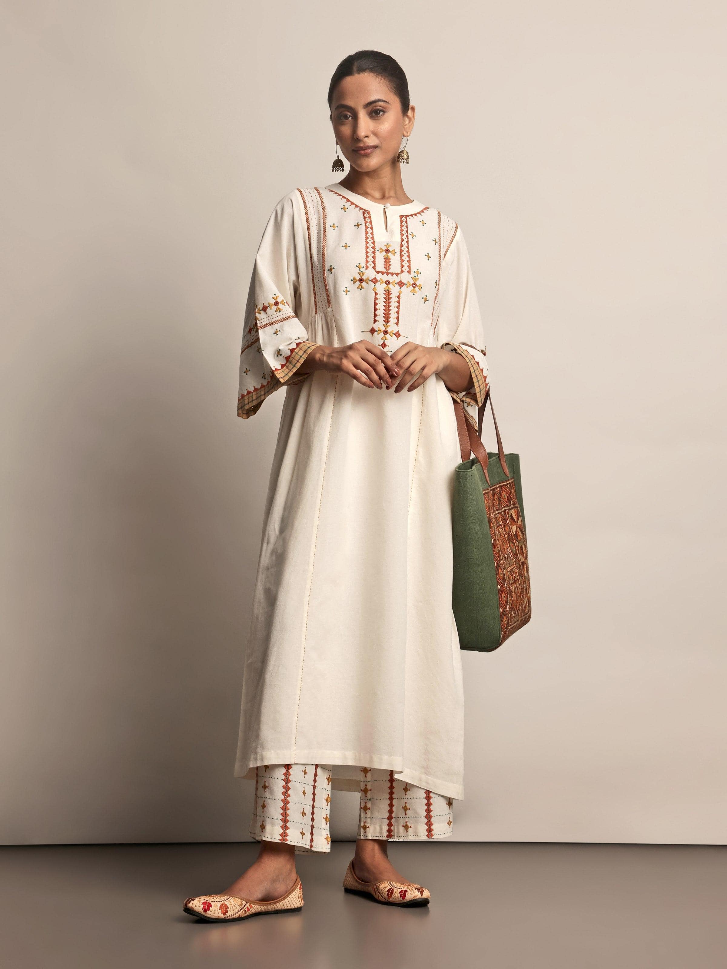Lifestyle view of Off-white Cotton Rajasthani Embroidered Palazzo worn casually, highlighting embroidery details and comfortable fit.