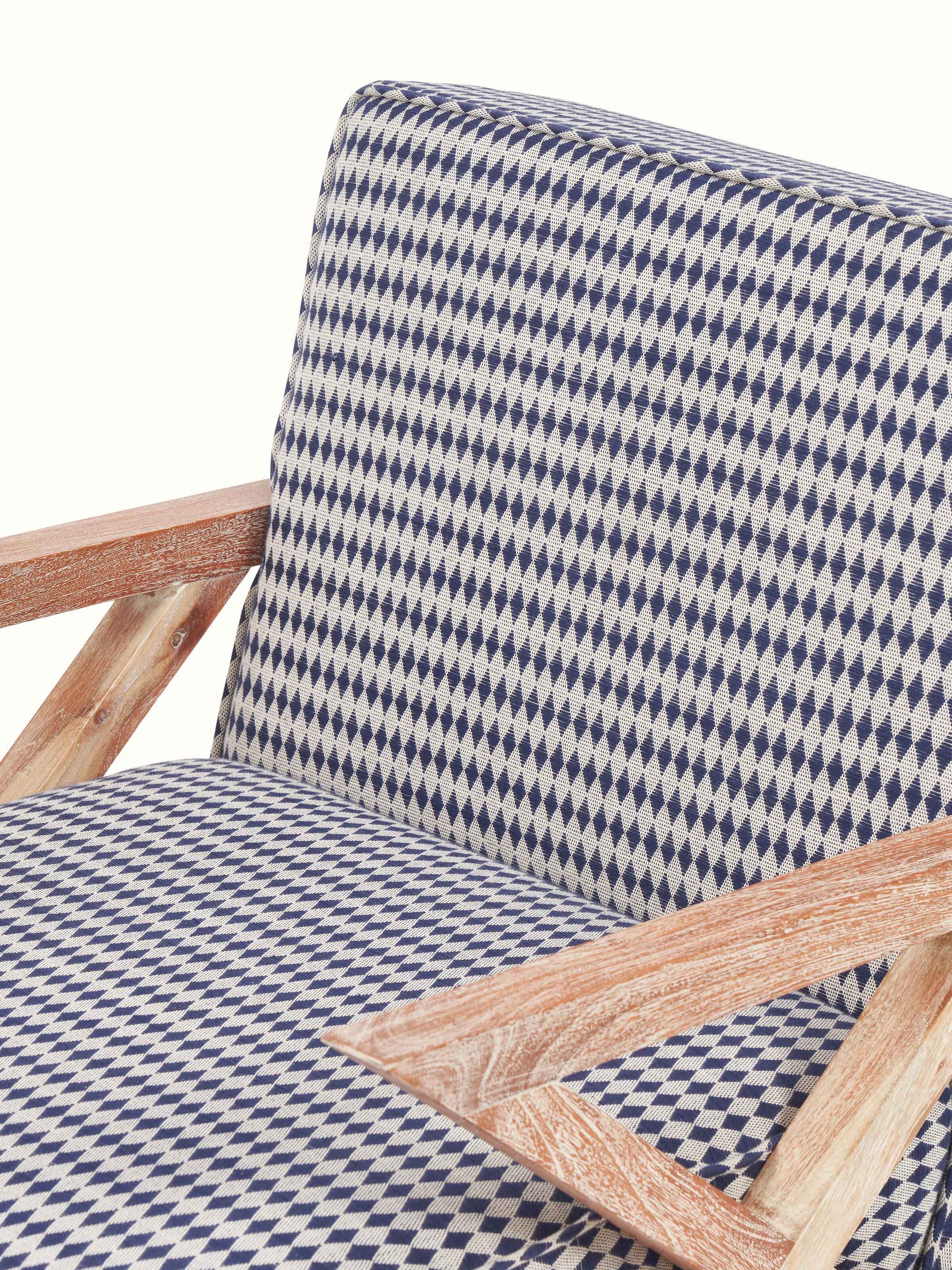 Detailed back view of Swadesh Upholstered Acacia Wood Armchair displaying the rich wood finish and plush back support