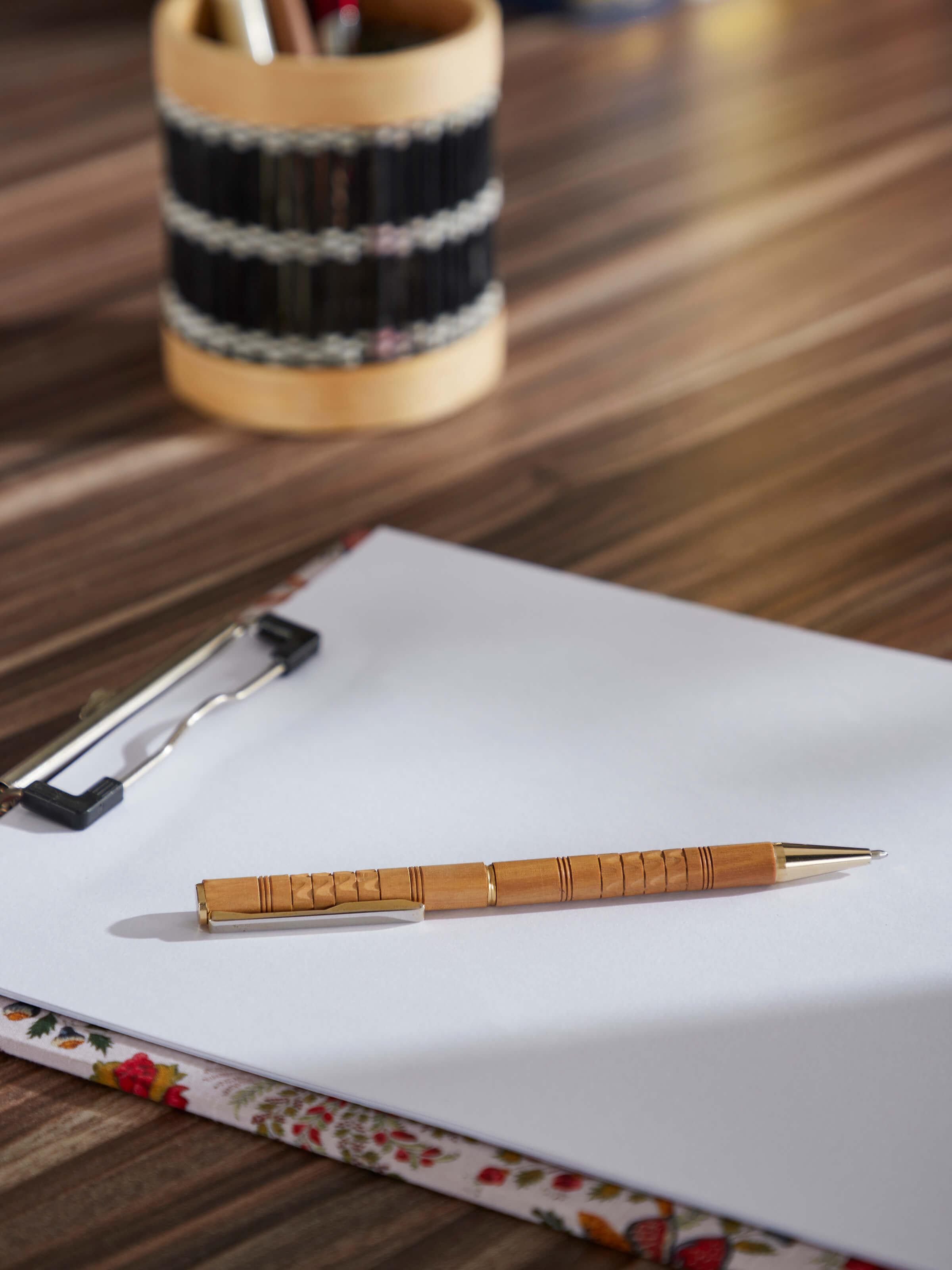 Side view of Carved Sandalwood Pen by Swadesh displaying the elegant carvings along the pen's length.