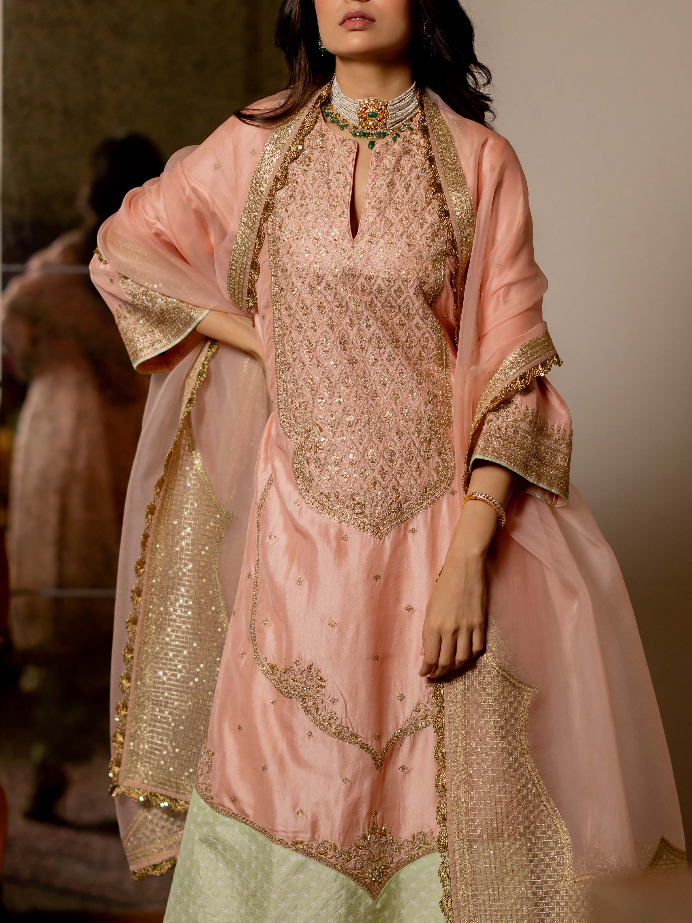 Angled view of the Off-white Silk Brocade Handloom Banarasi Saree