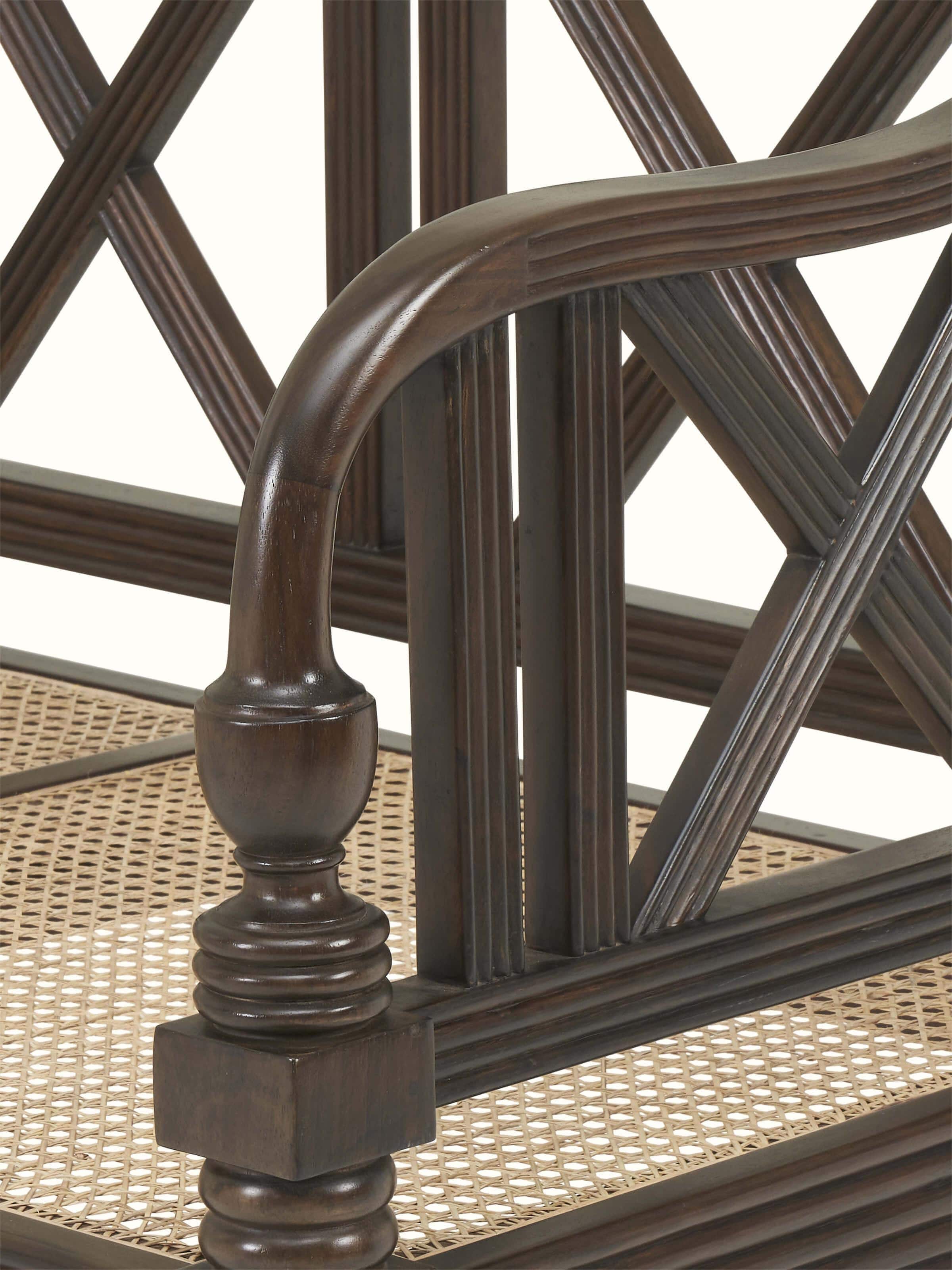 Detailed view of Walnut finish Mahogany wood and cane sofa emphasizing handwoven cane craftsmanship