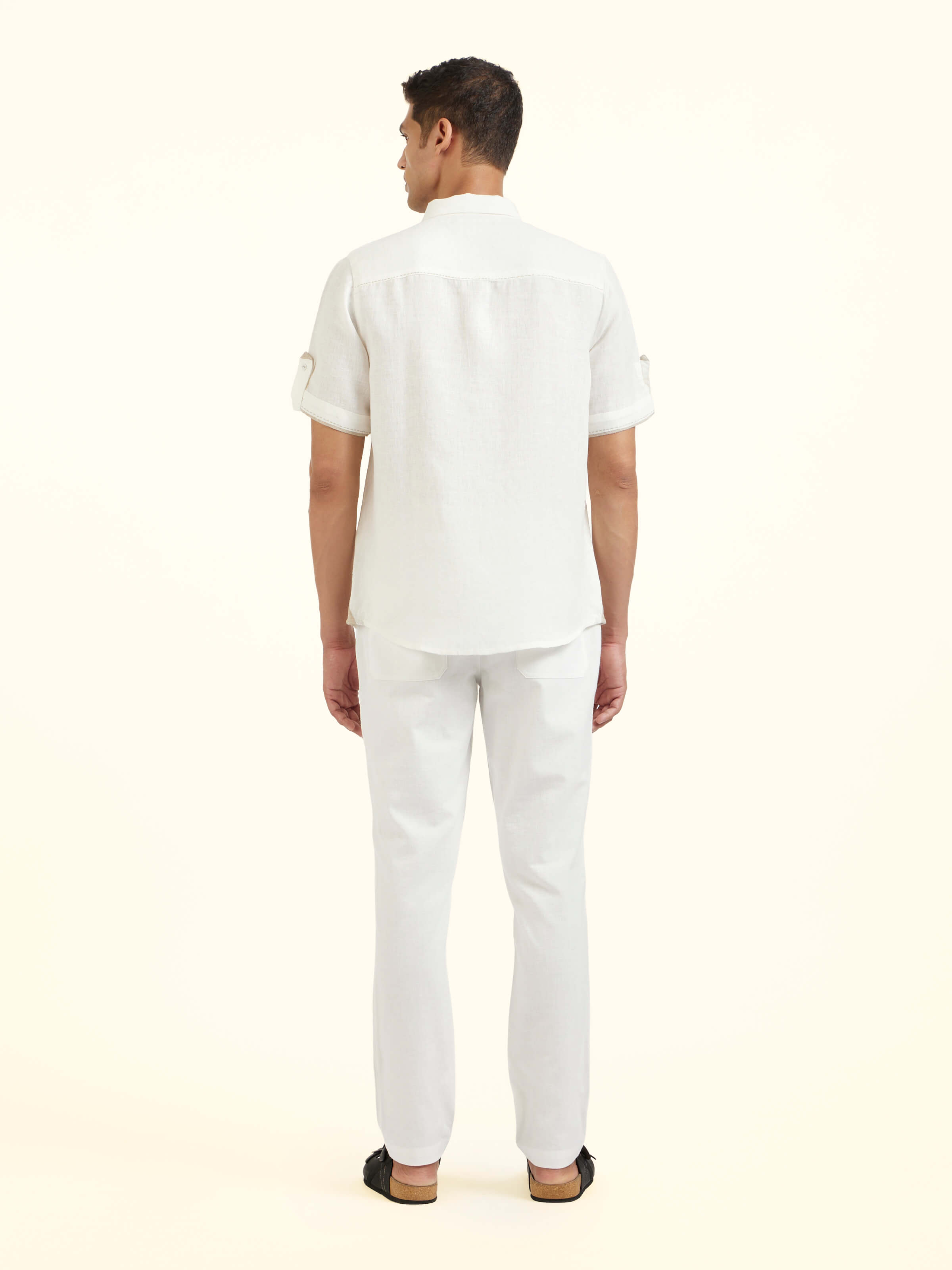 Back view of white Peter Pan collar linen shirt with clean minimalist finish