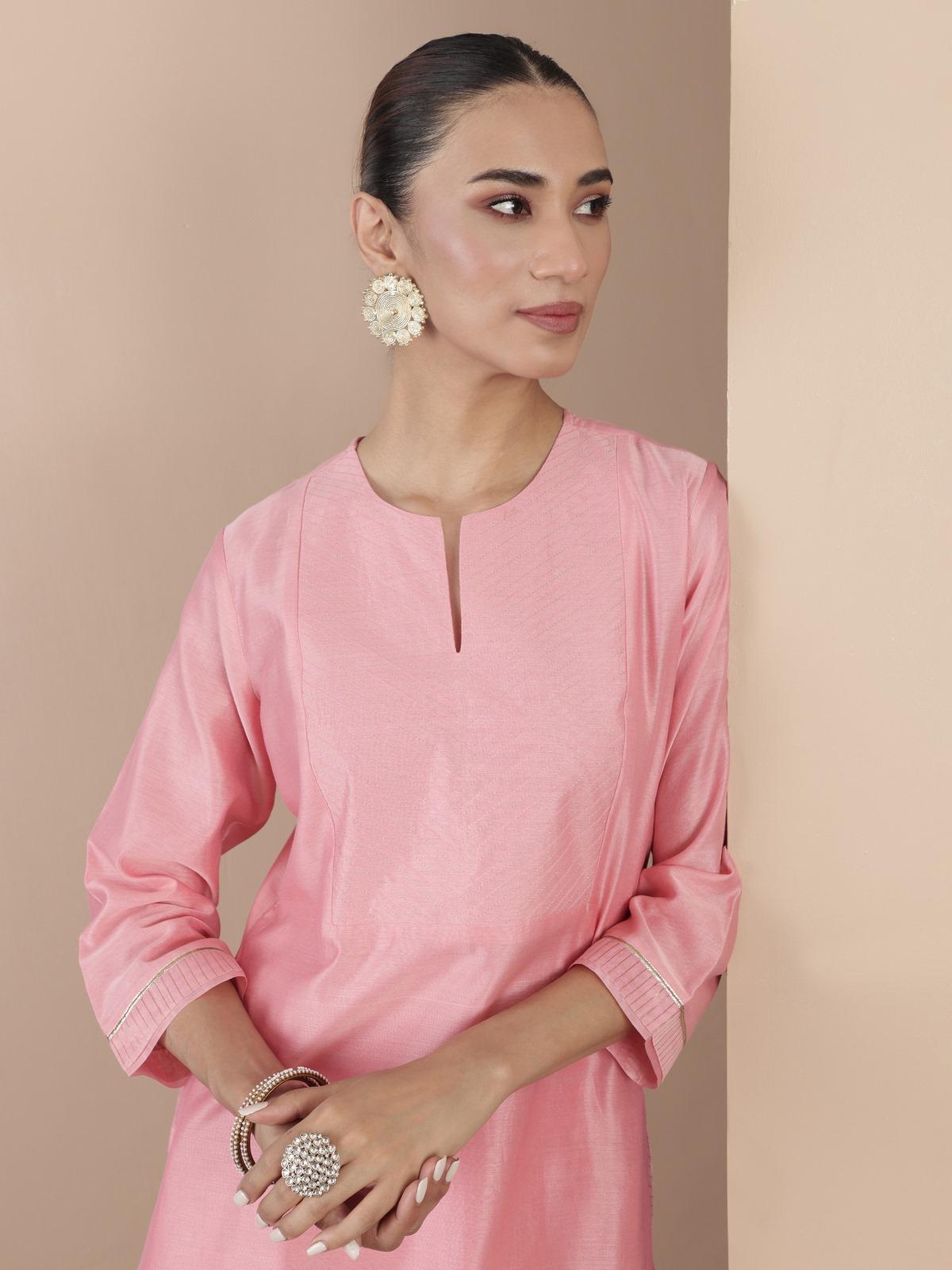 Detailed close-up of weave and fabric quality of pink cotton silk Chanderi tunic.