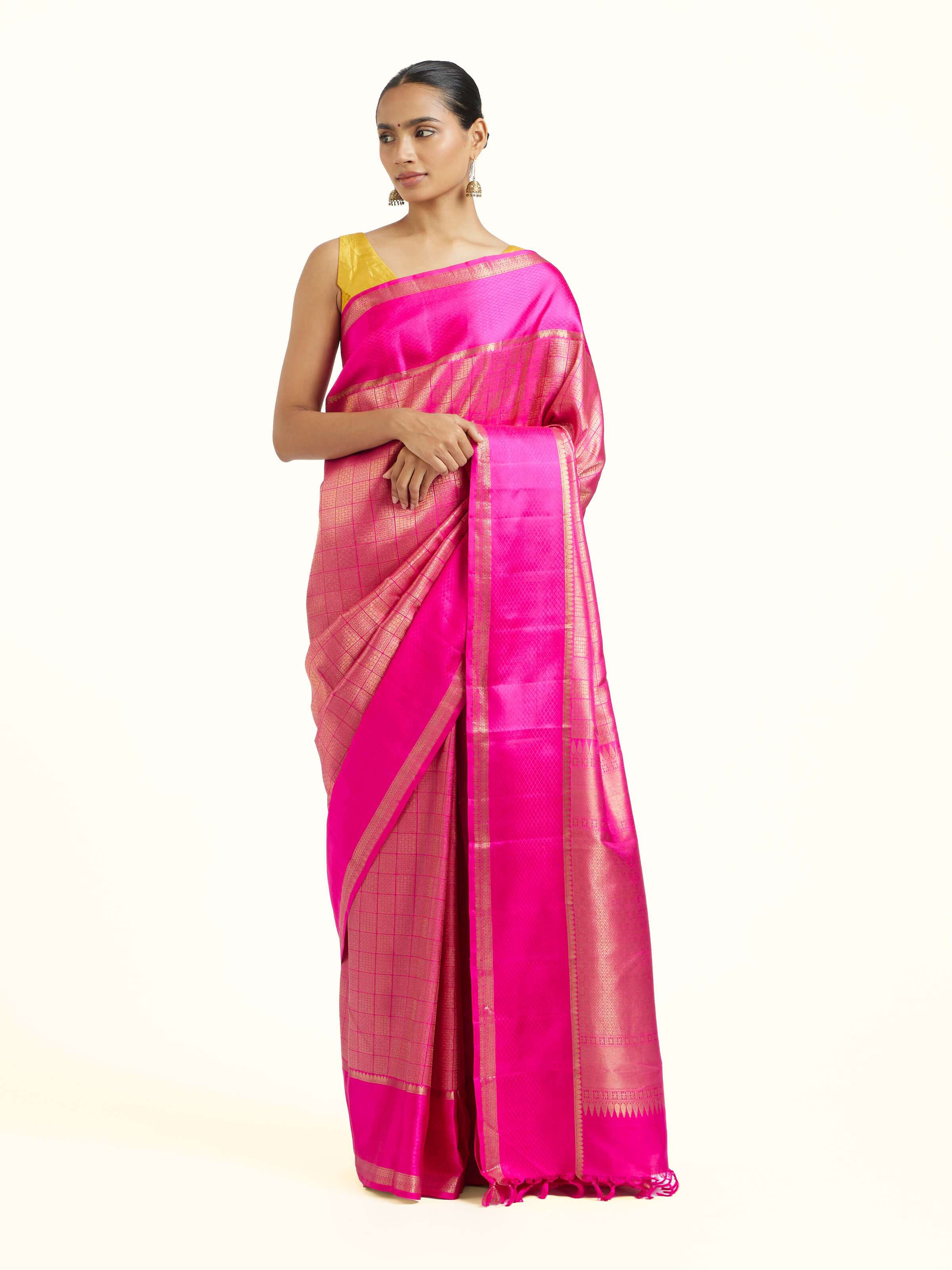 Front view of pink silk Kancheepuram saree with rich zari woven motifs