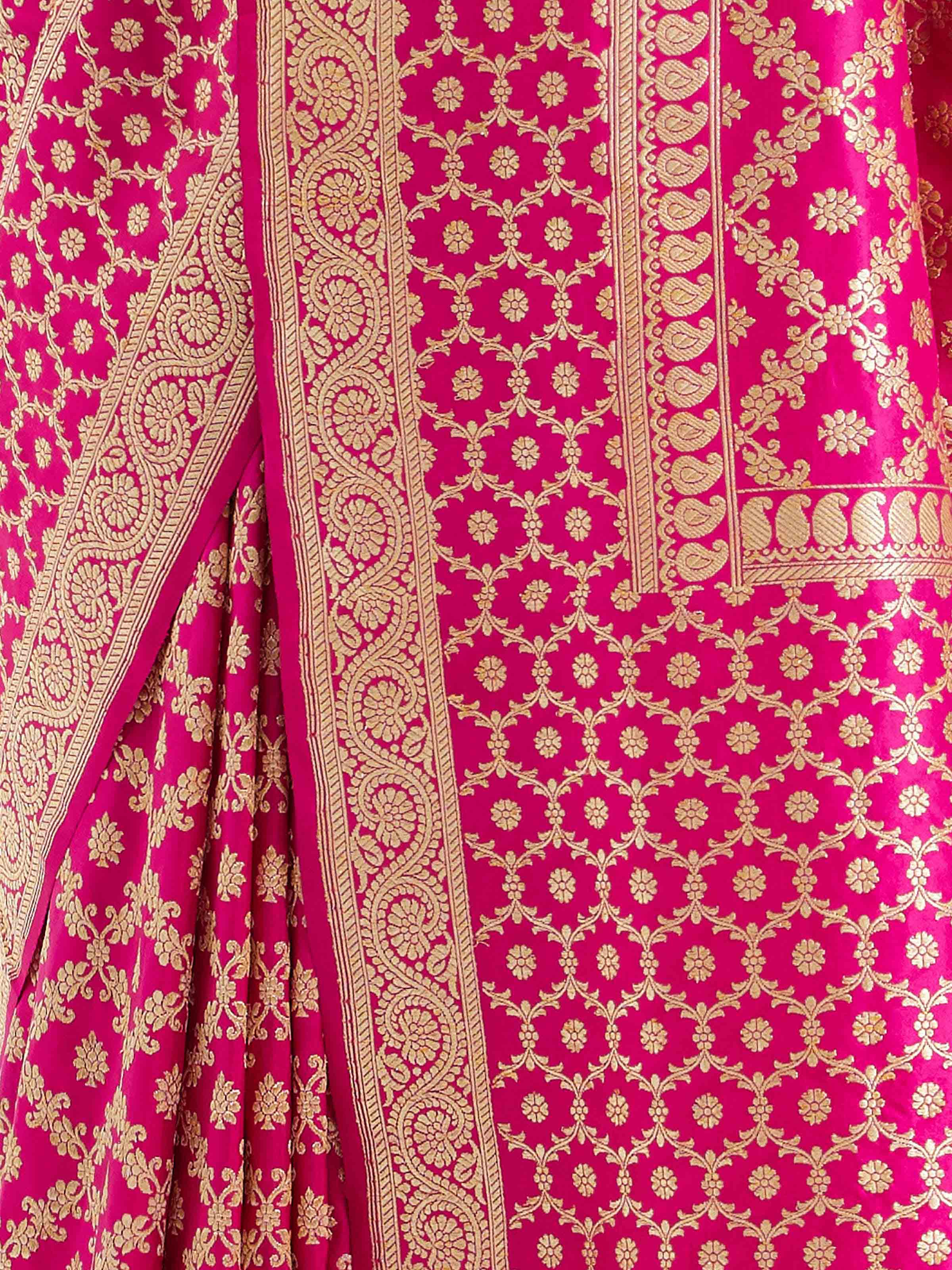 Detail view of fuschia katan silk Banarasi saree showing silk texture and zari work