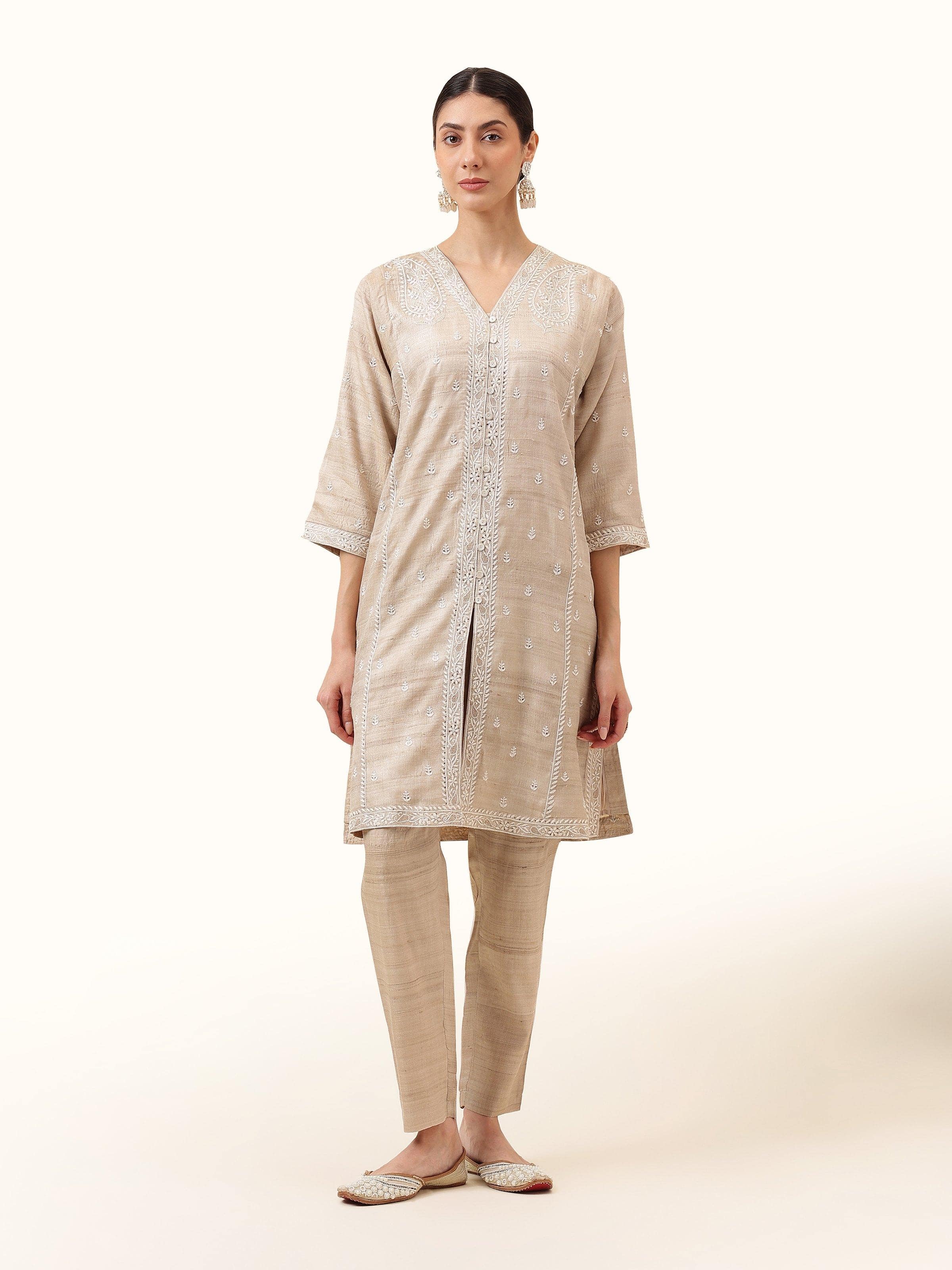 Front view of the beige tussar silk churidar, showcasing its elegant finish and rich silk texture.