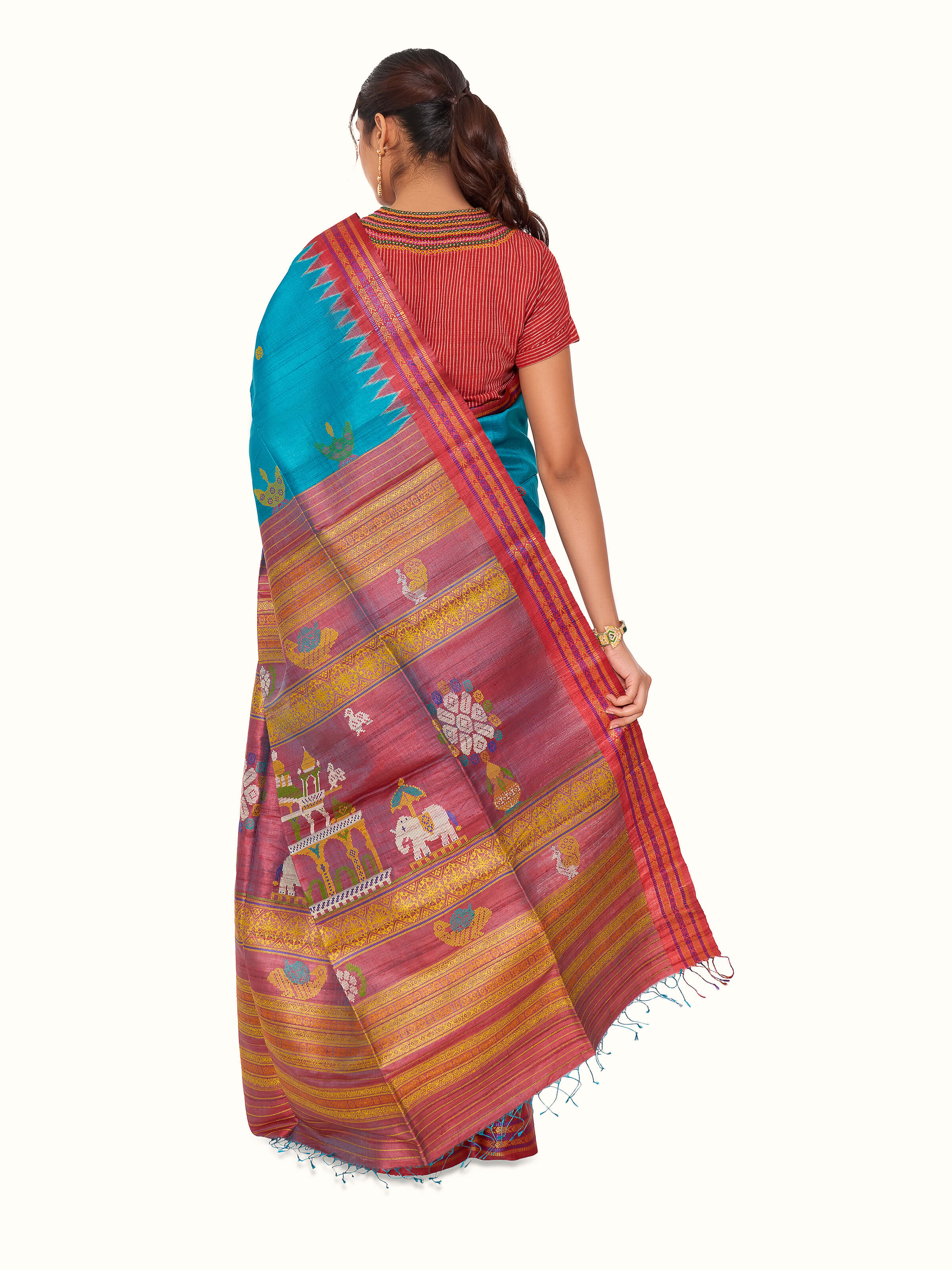 Back view of turquoise tussar silk Odisha ikat saree displaying pallu design
