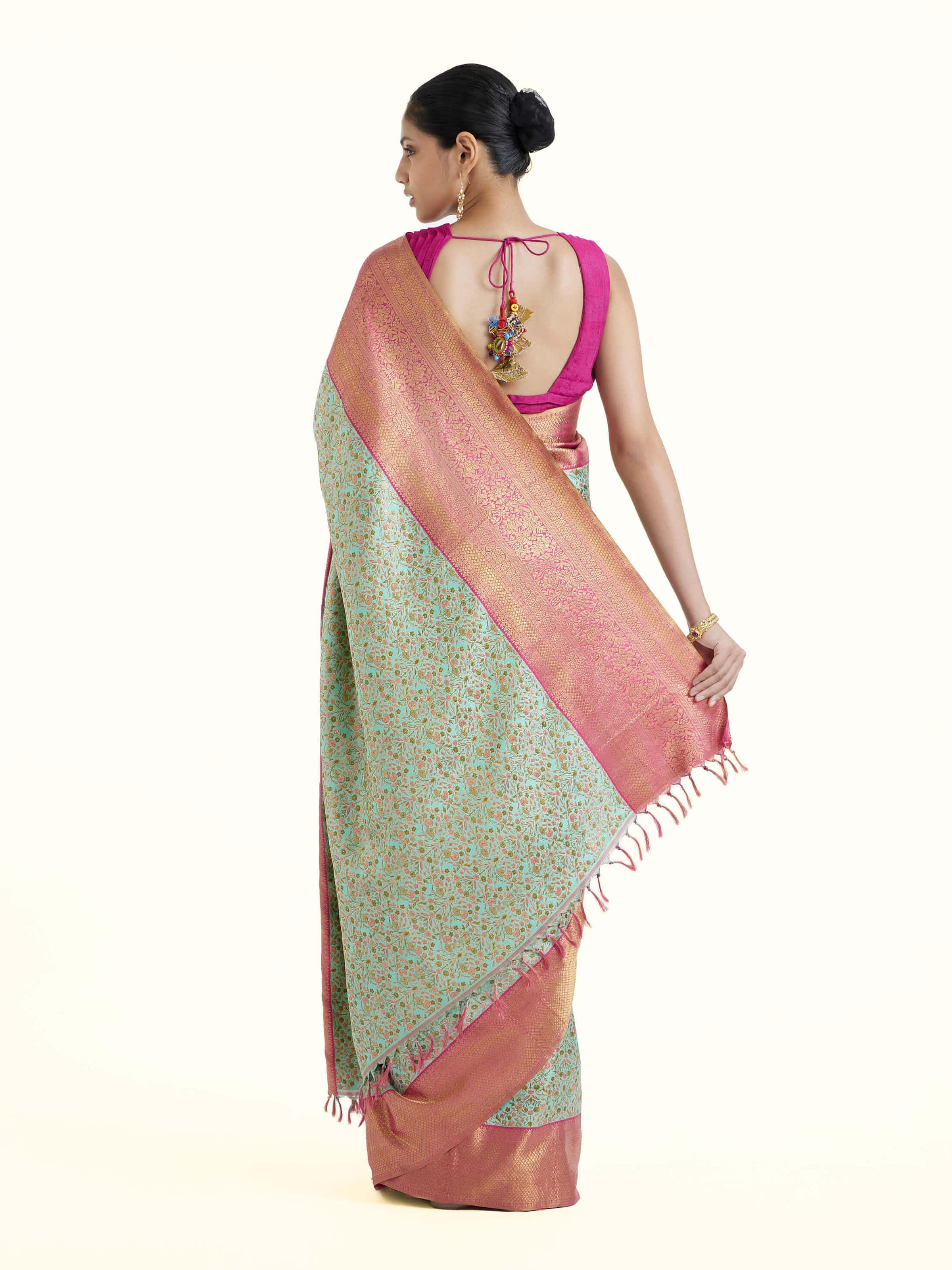 Back view of sea green silk Kancheepuram saree with ornate pallu design