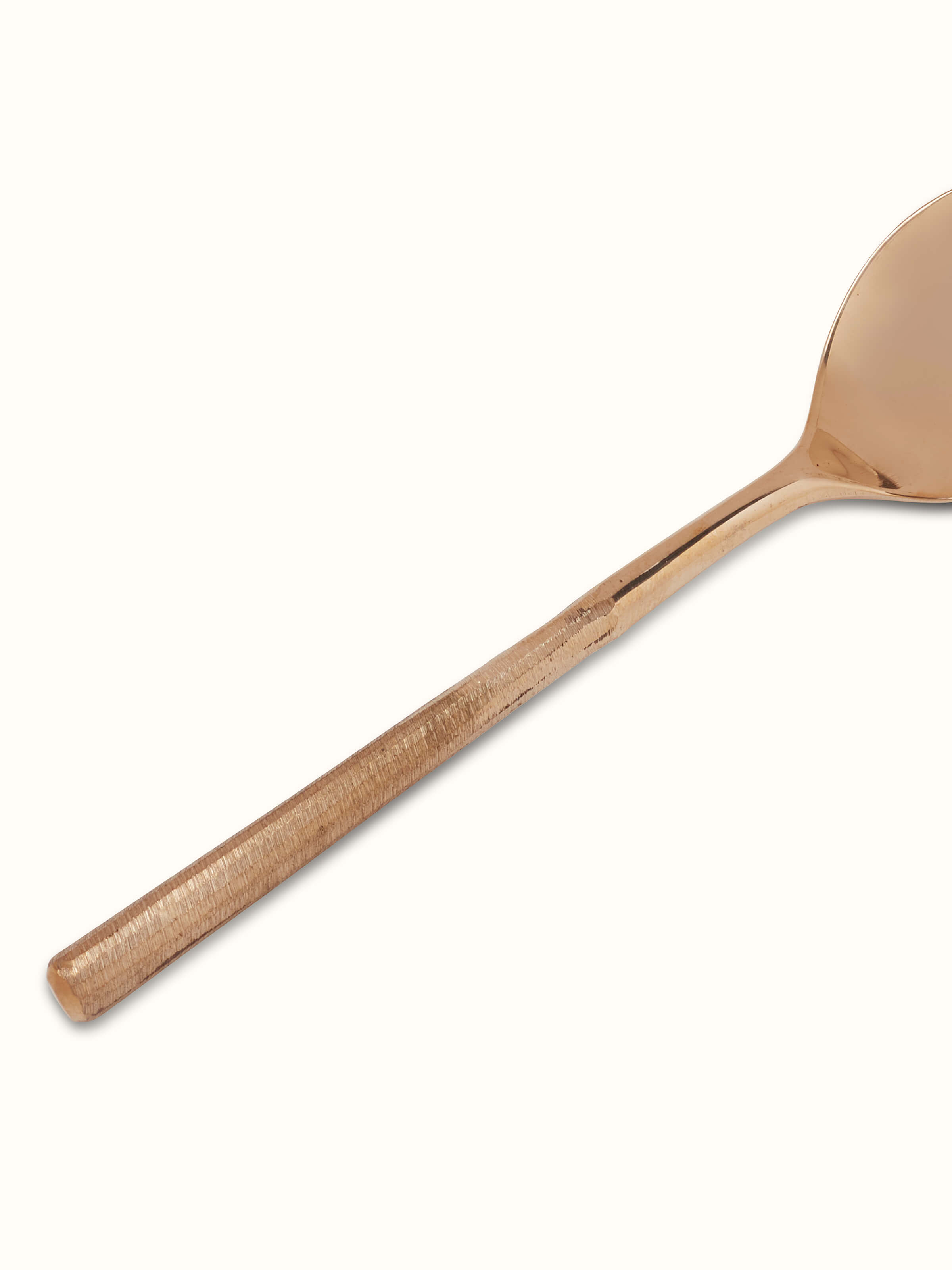 Detailed view of Bell metal teaspoon showcasing its refined design and finish