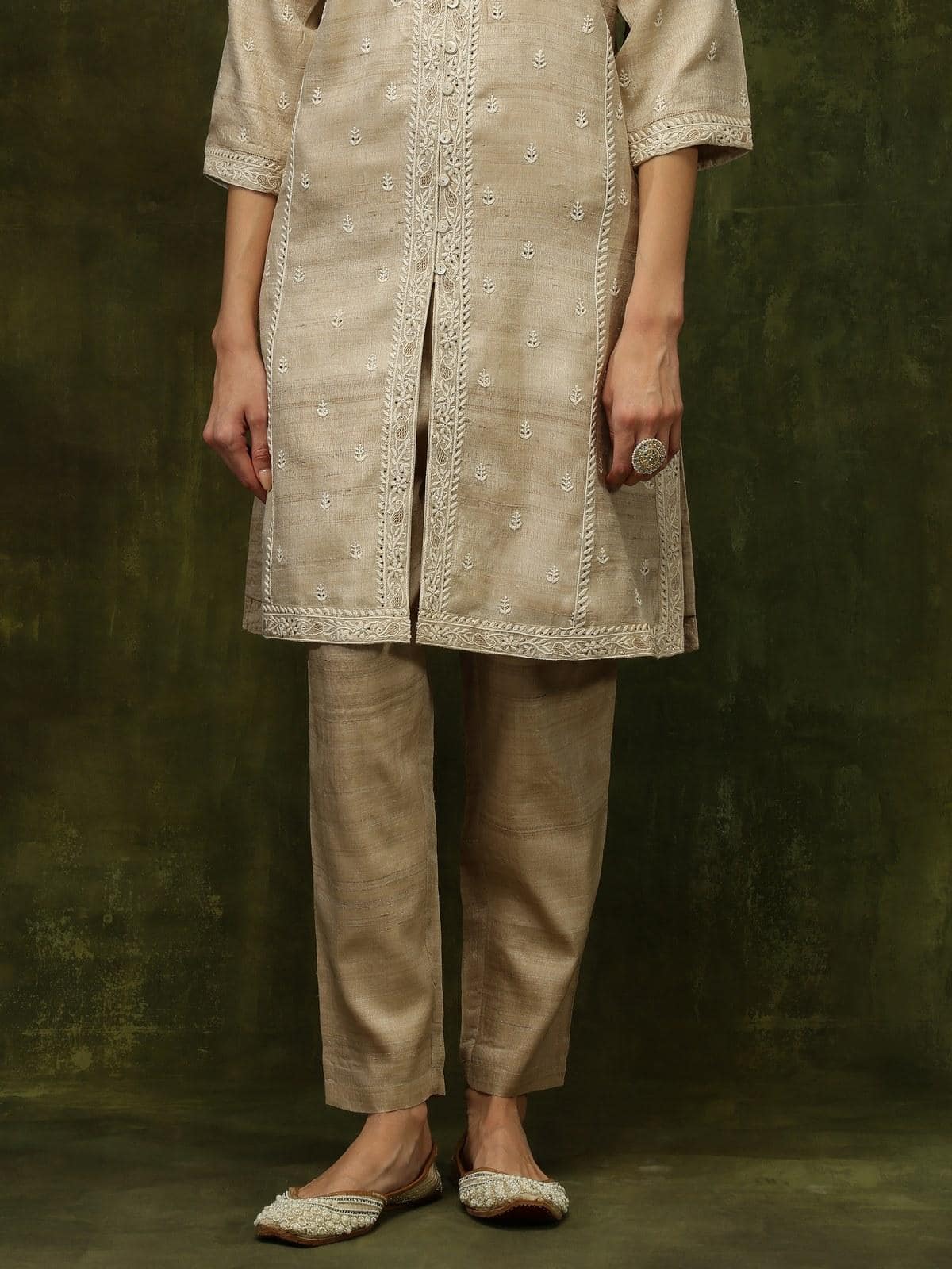 Side view offering a glimpse of the smooth drape and natural sheen.