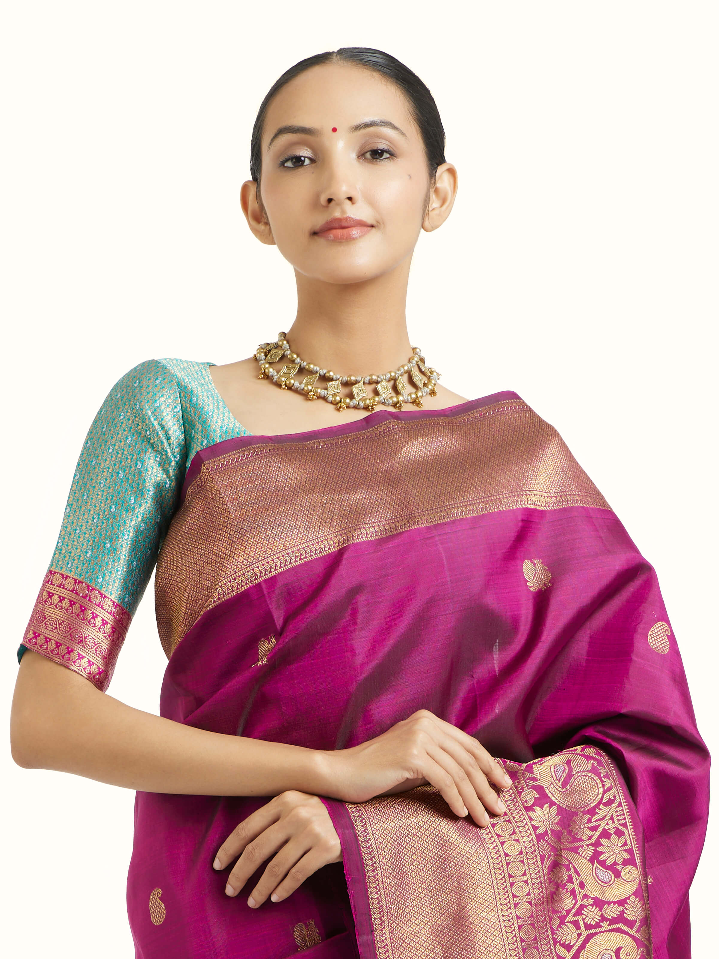 Angled view of purple silk Kancheepuram saree highlighting traditional weave