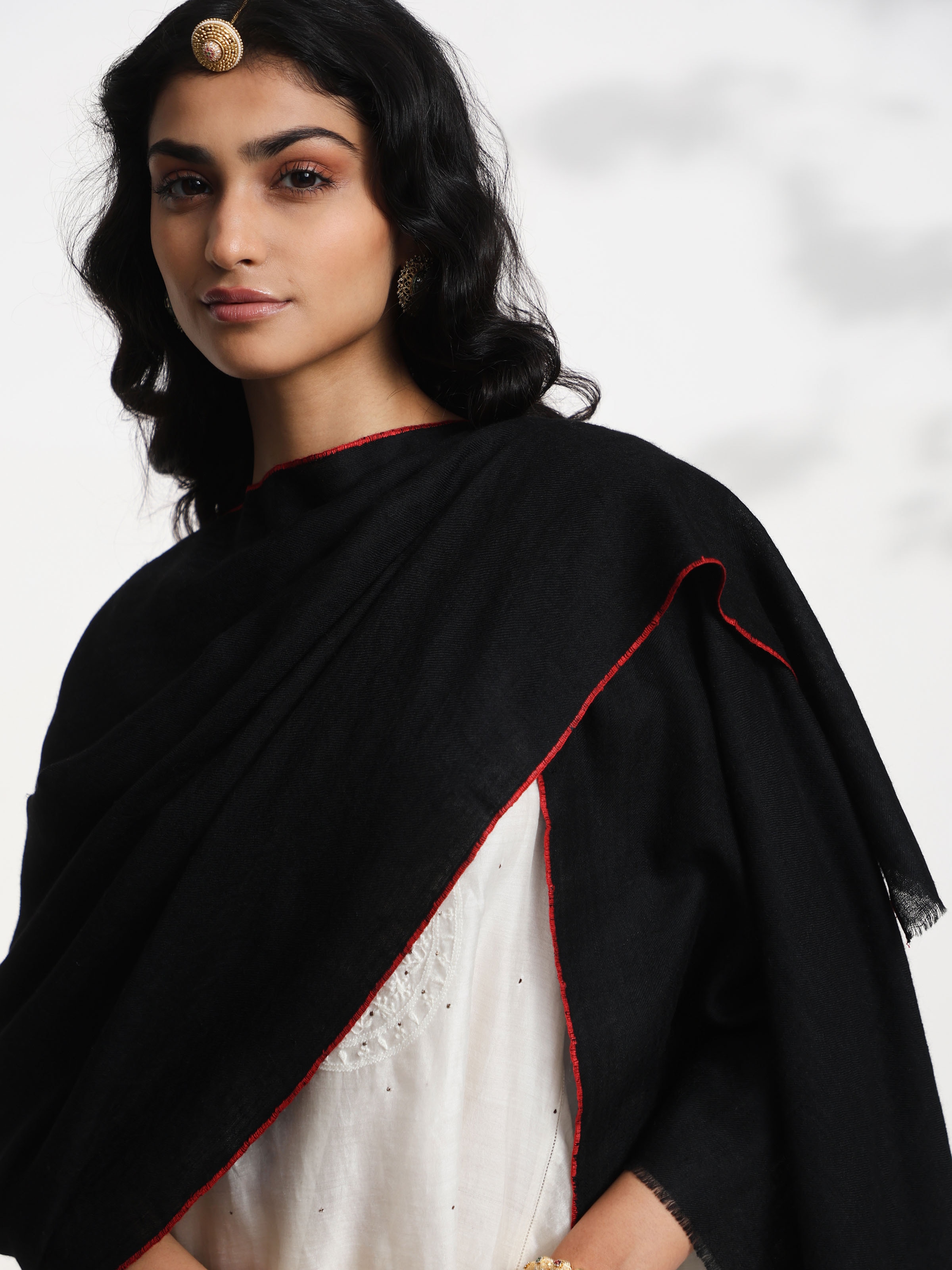 Detail view of black cashmere kaaj embroidered handwoven stole showcasing craftsmanship