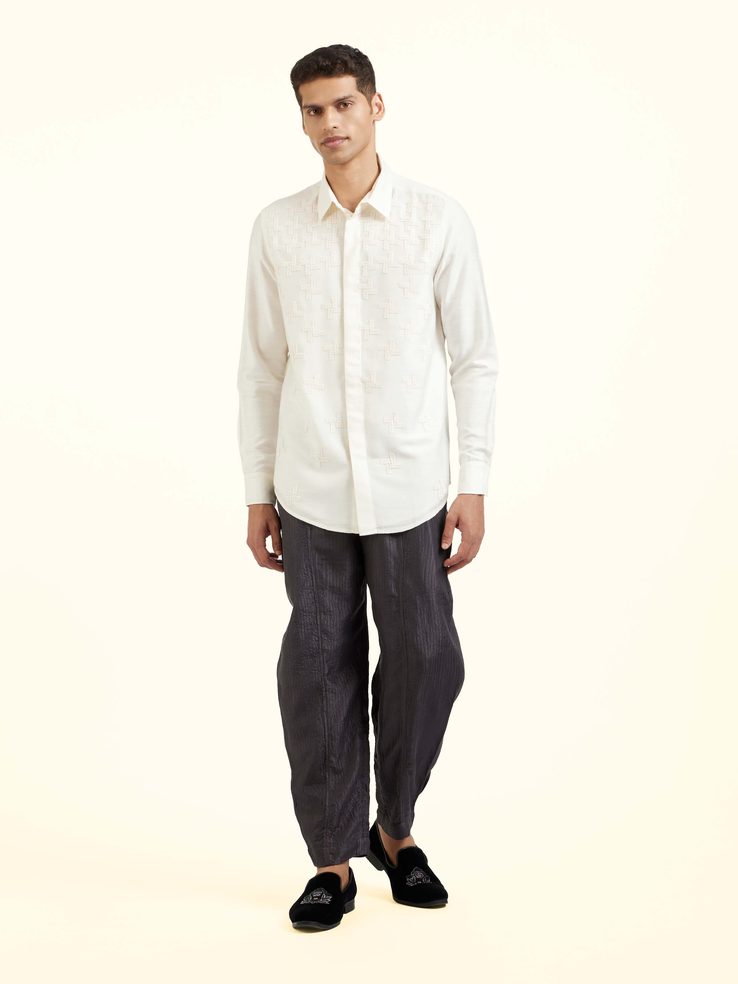 Front view of white hand embroidery shirt showcasing delicate embroidered detailing