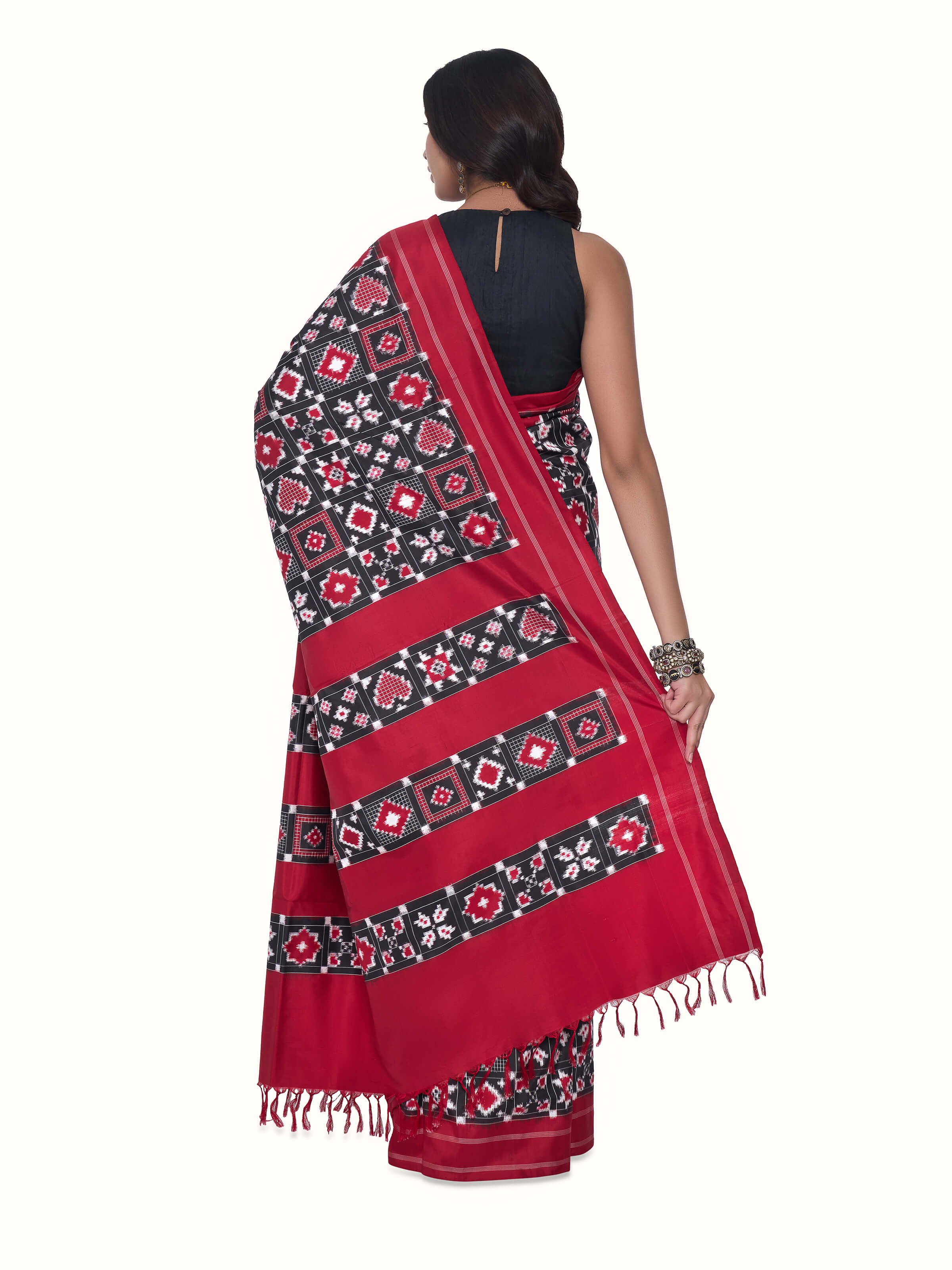 Back view of red silk Telia Rumal double ikat saree displaying distinctive pallu design
