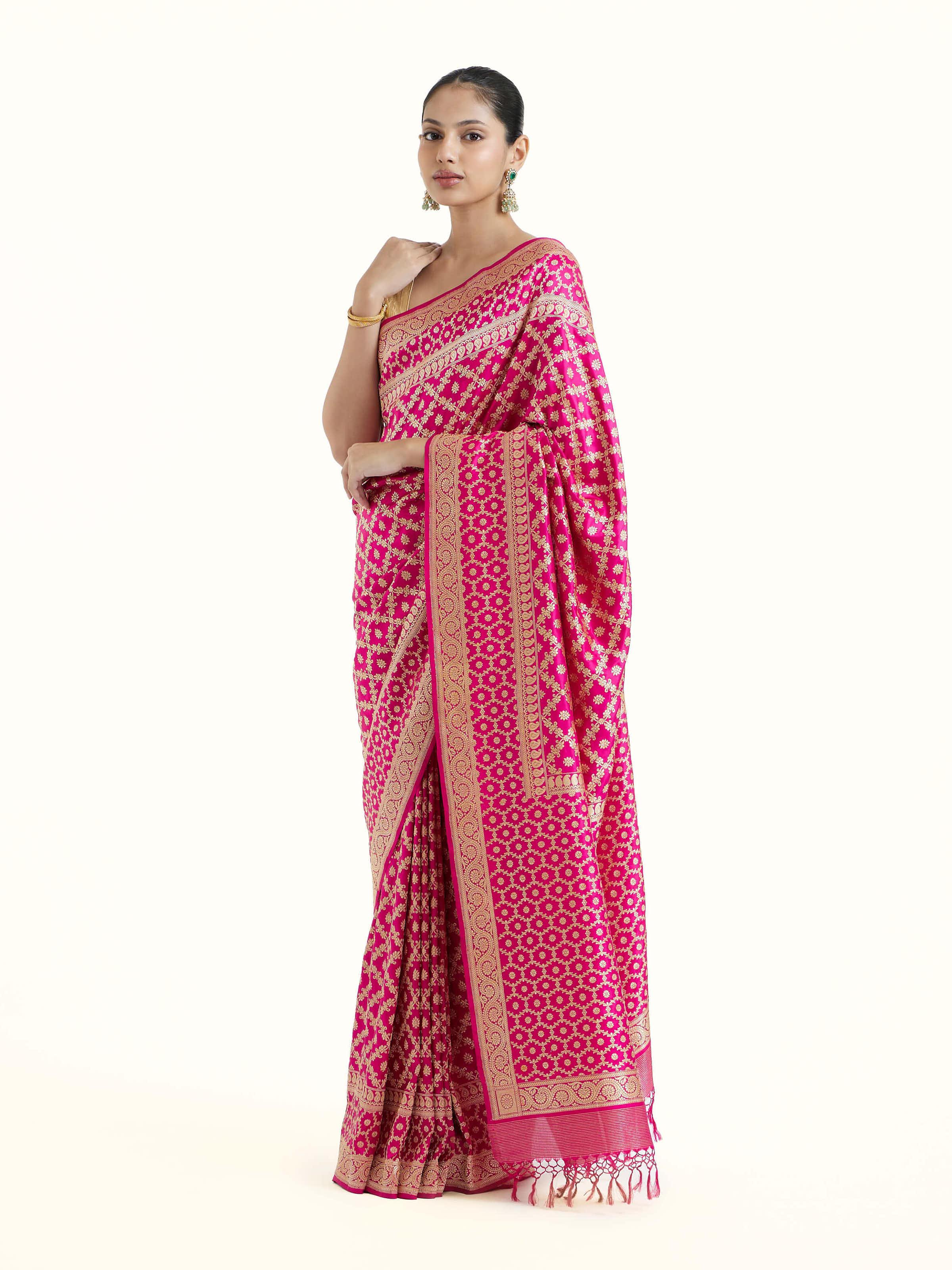 Side view of fuschia katan silk Banarasi saree showcasing elegant drape