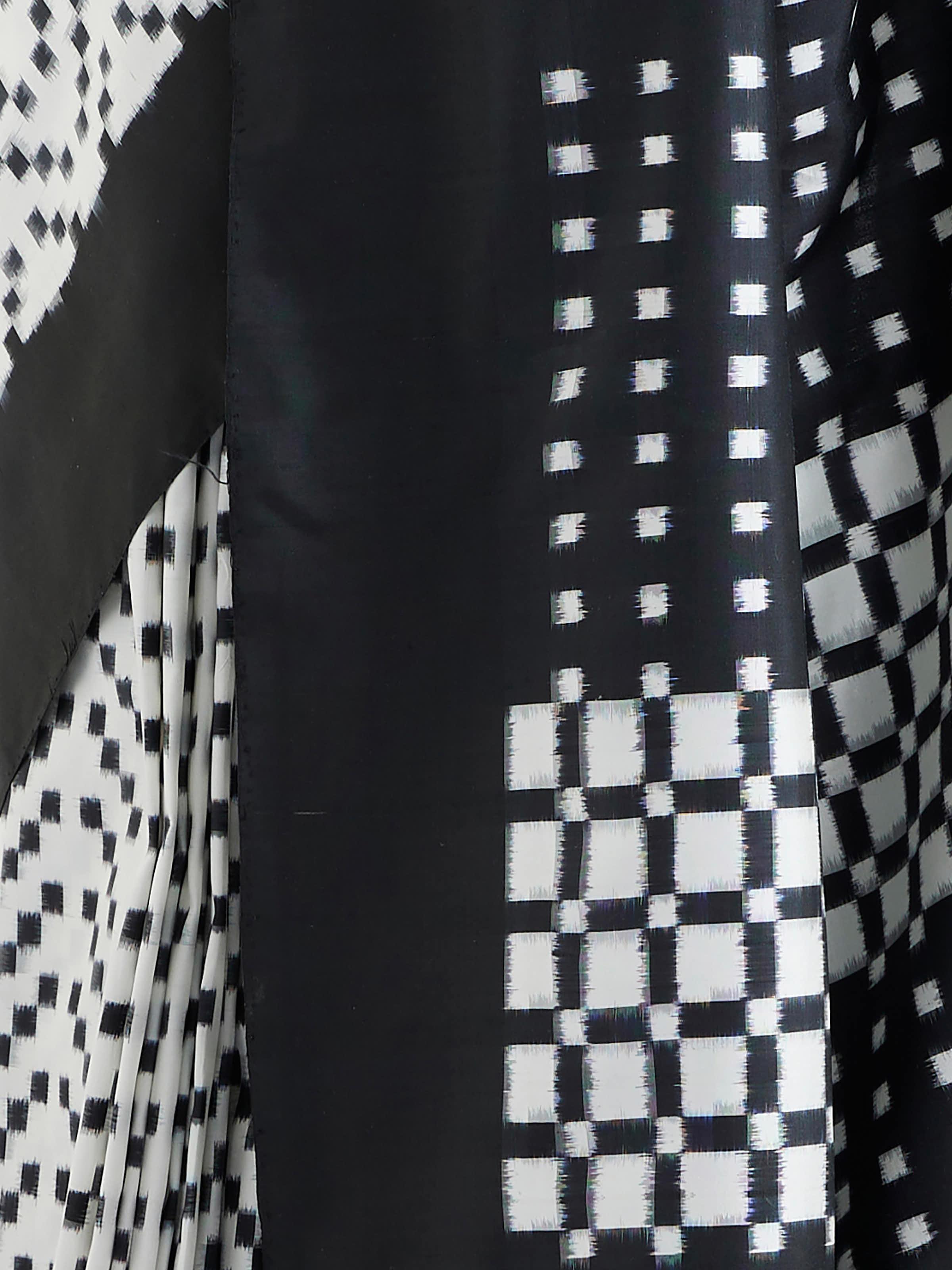 Detail view of black silk double ikat saree showing fabric texture and craftsmanship