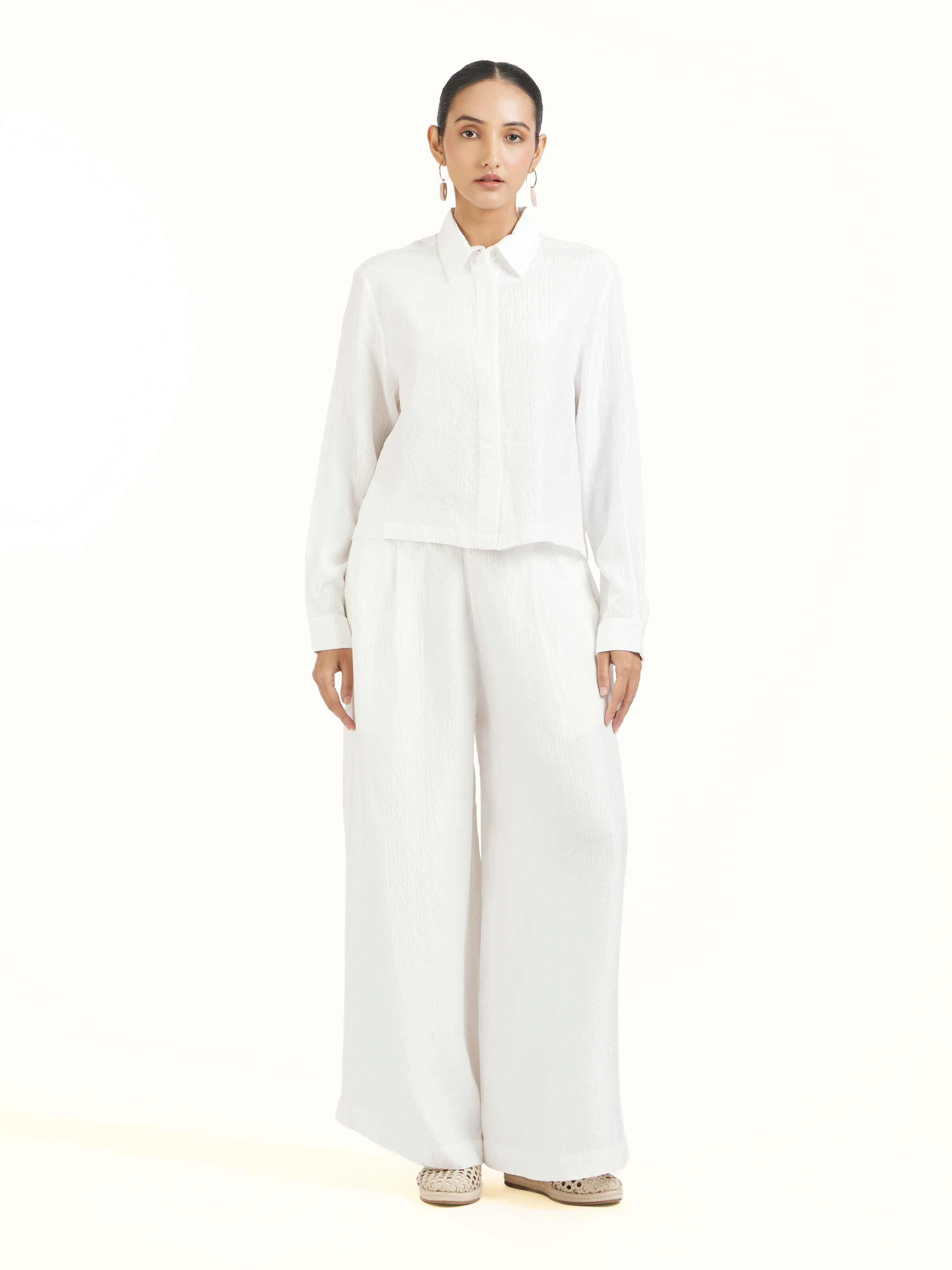 Front view of ivory quilted silk shirt with refined texture