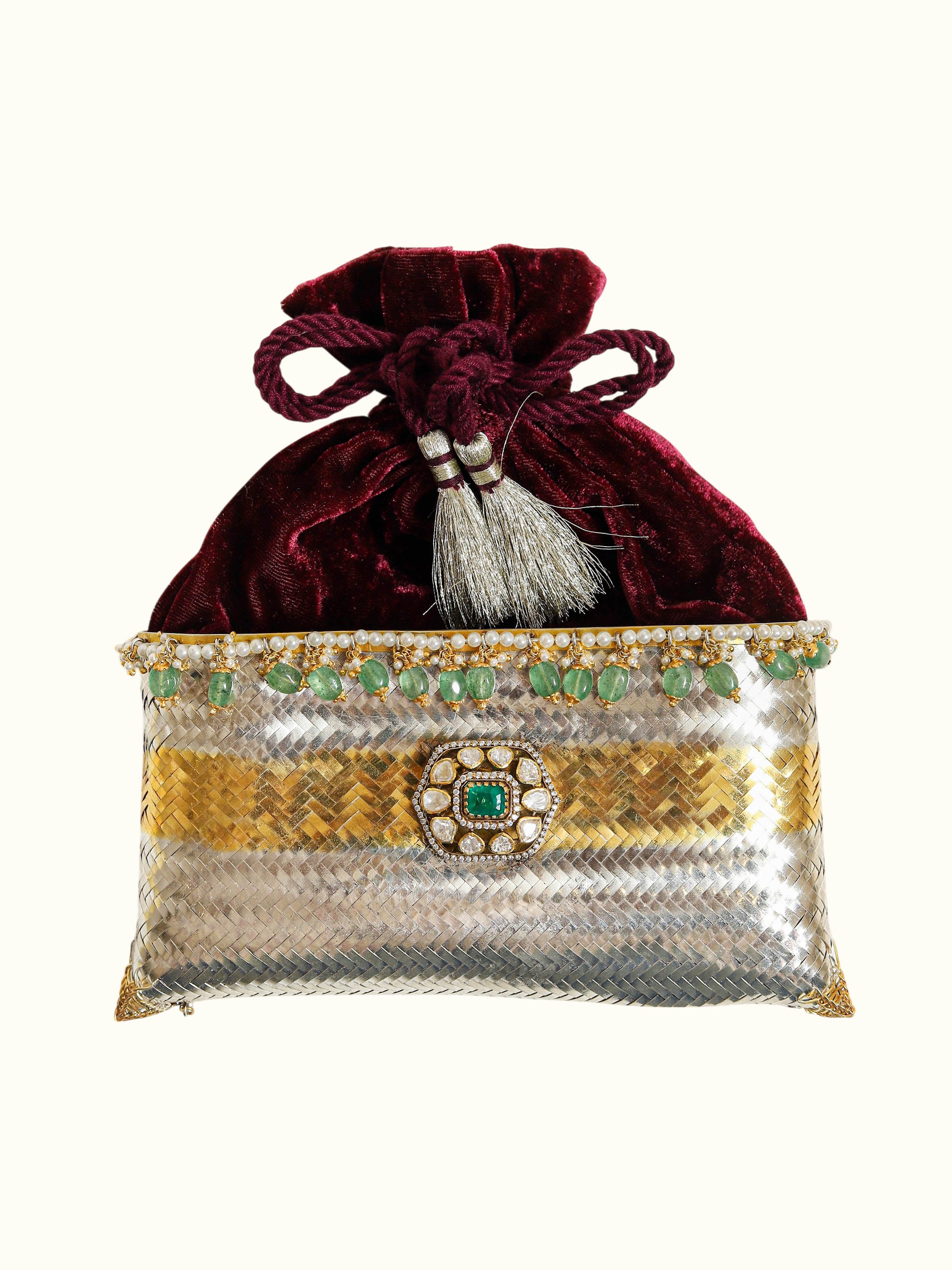 front view of silver smithing two-tone potli-style bag with decorative detailing