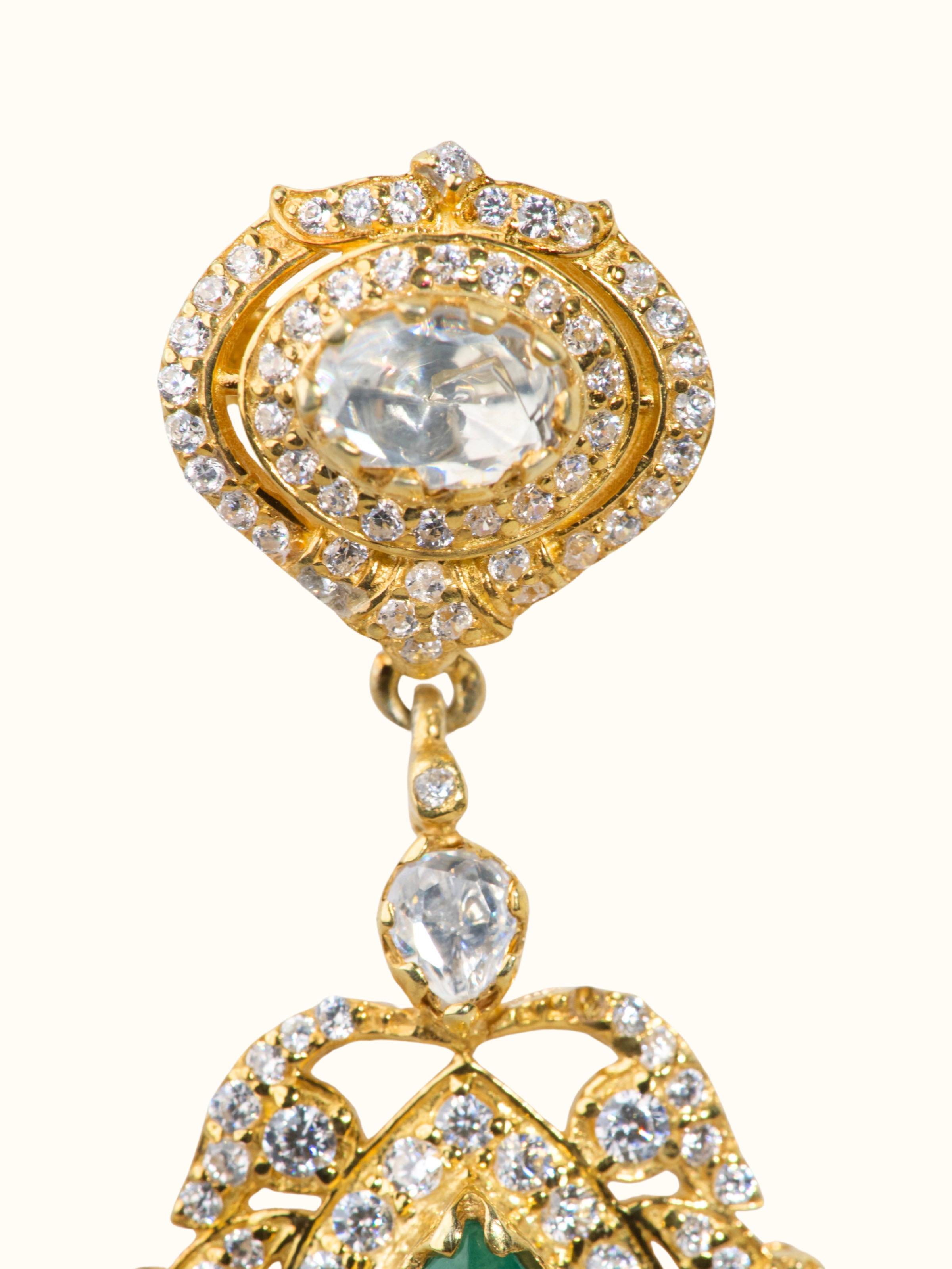 Close-up of handcrafted silver smithing detail on drop earrings