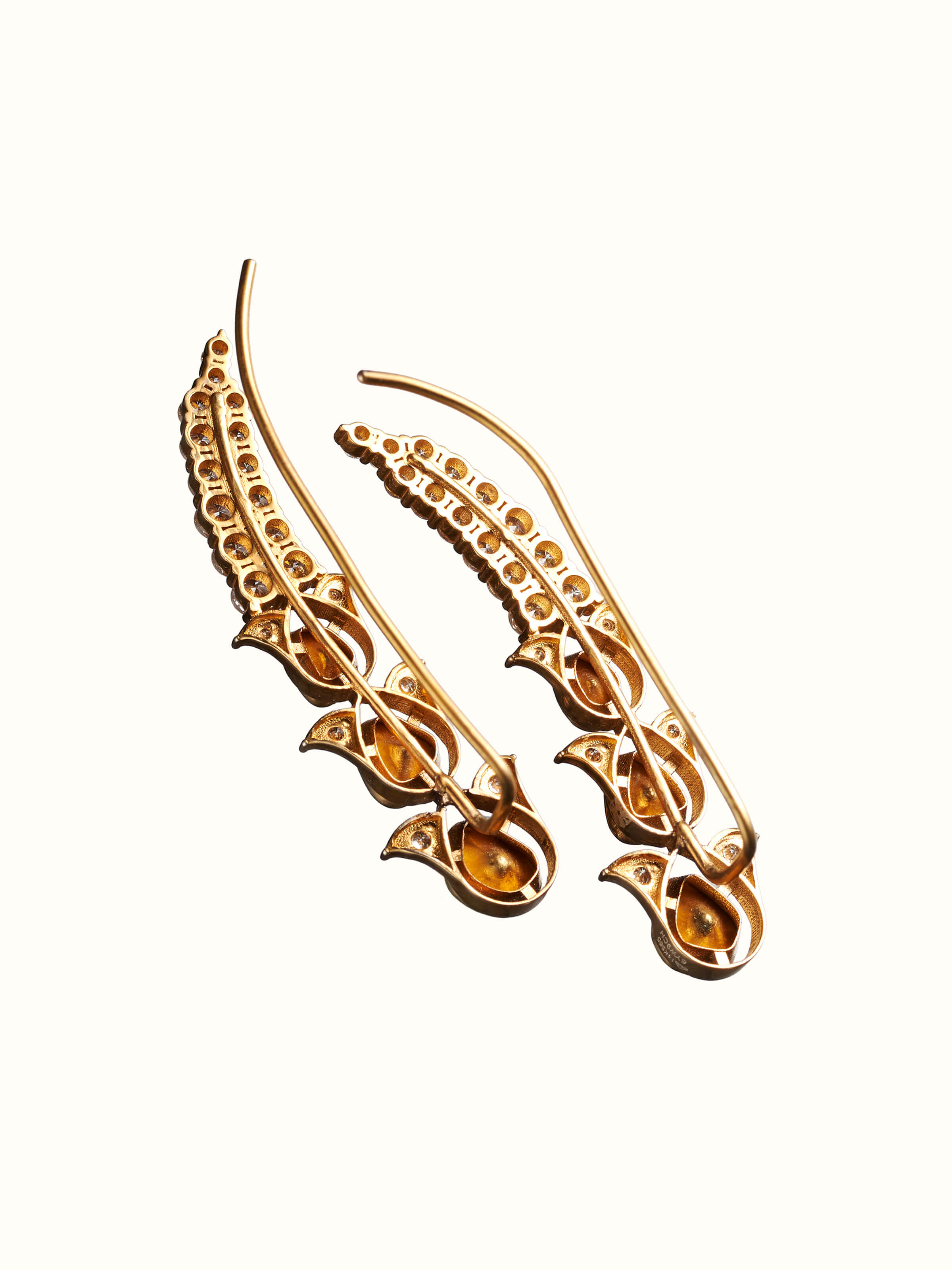 back view of dank polki 14 karat gold drop earrings