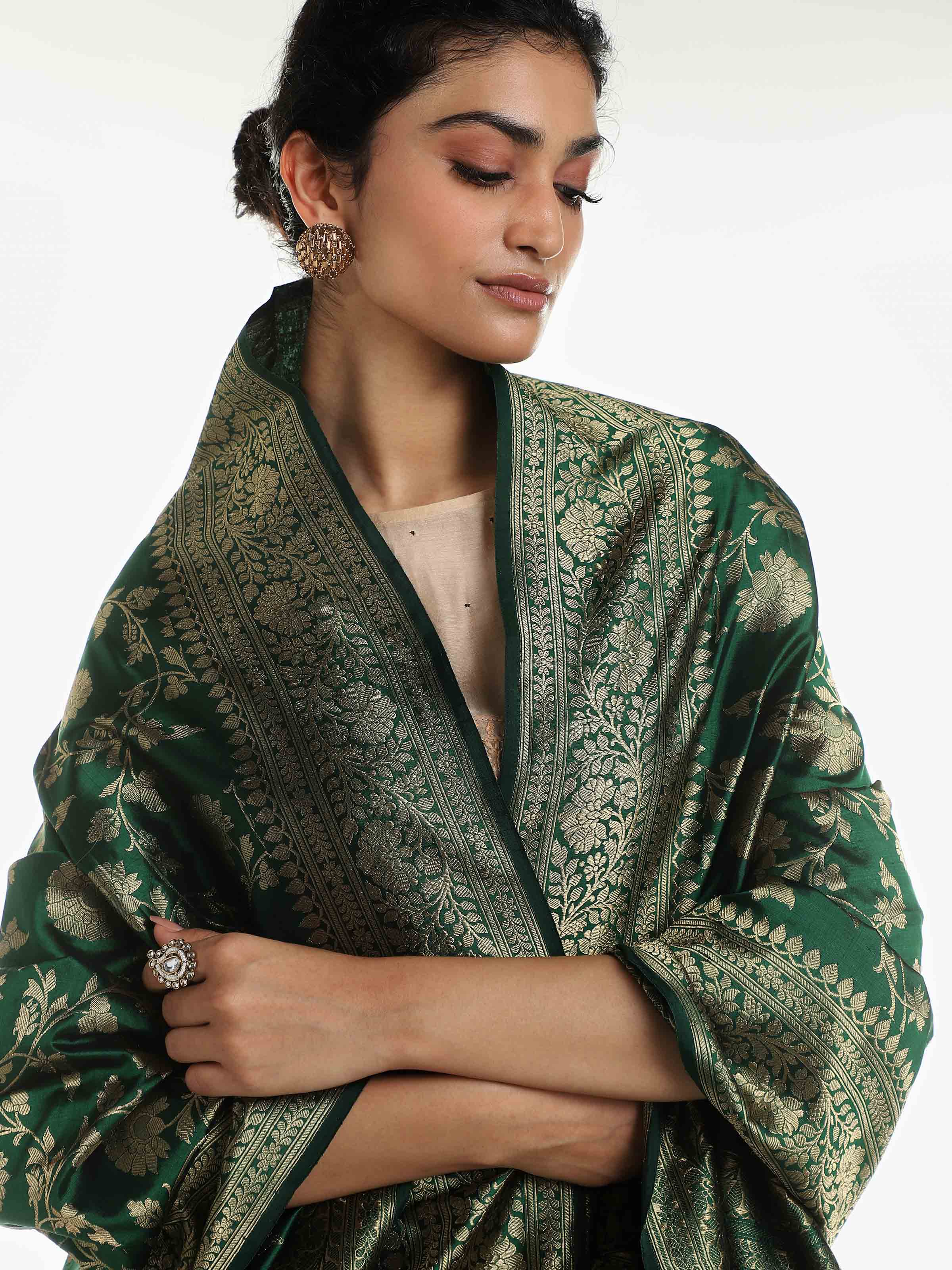 Detail view of dark green silk Banarasi dupatta with fabric texture and zari weave