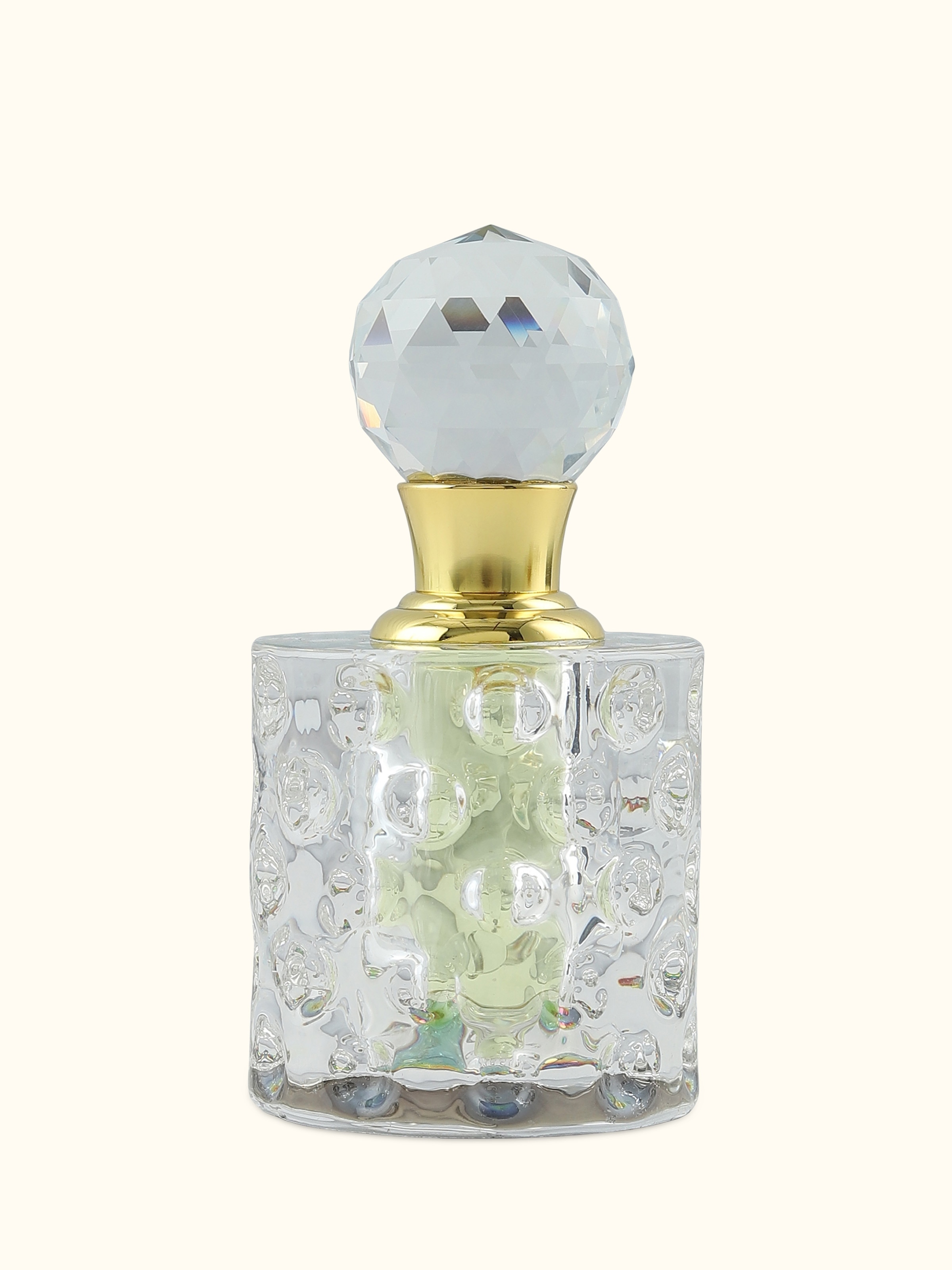 Front view of Attar Basant perfume bottle highlighting the fresh golden hue and minimalistic design