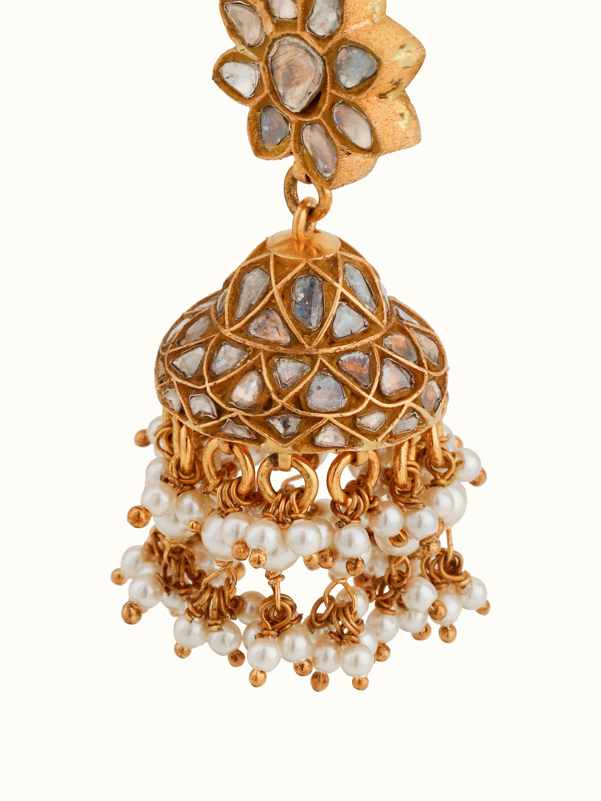 Detailed view of Thappa jhumka with intricate Thappa work and dangling gold drops
