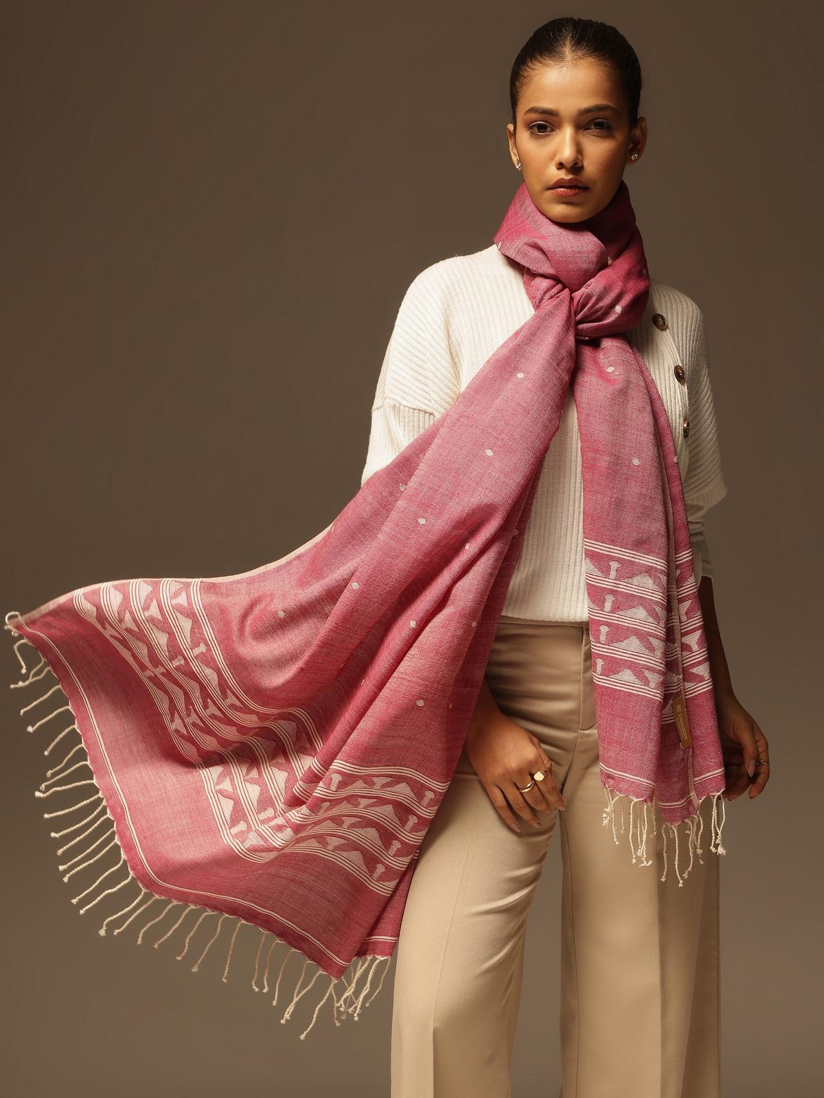 Side lifestyle view showing the soft wool texture and traditional patterns of the maroon shawl.