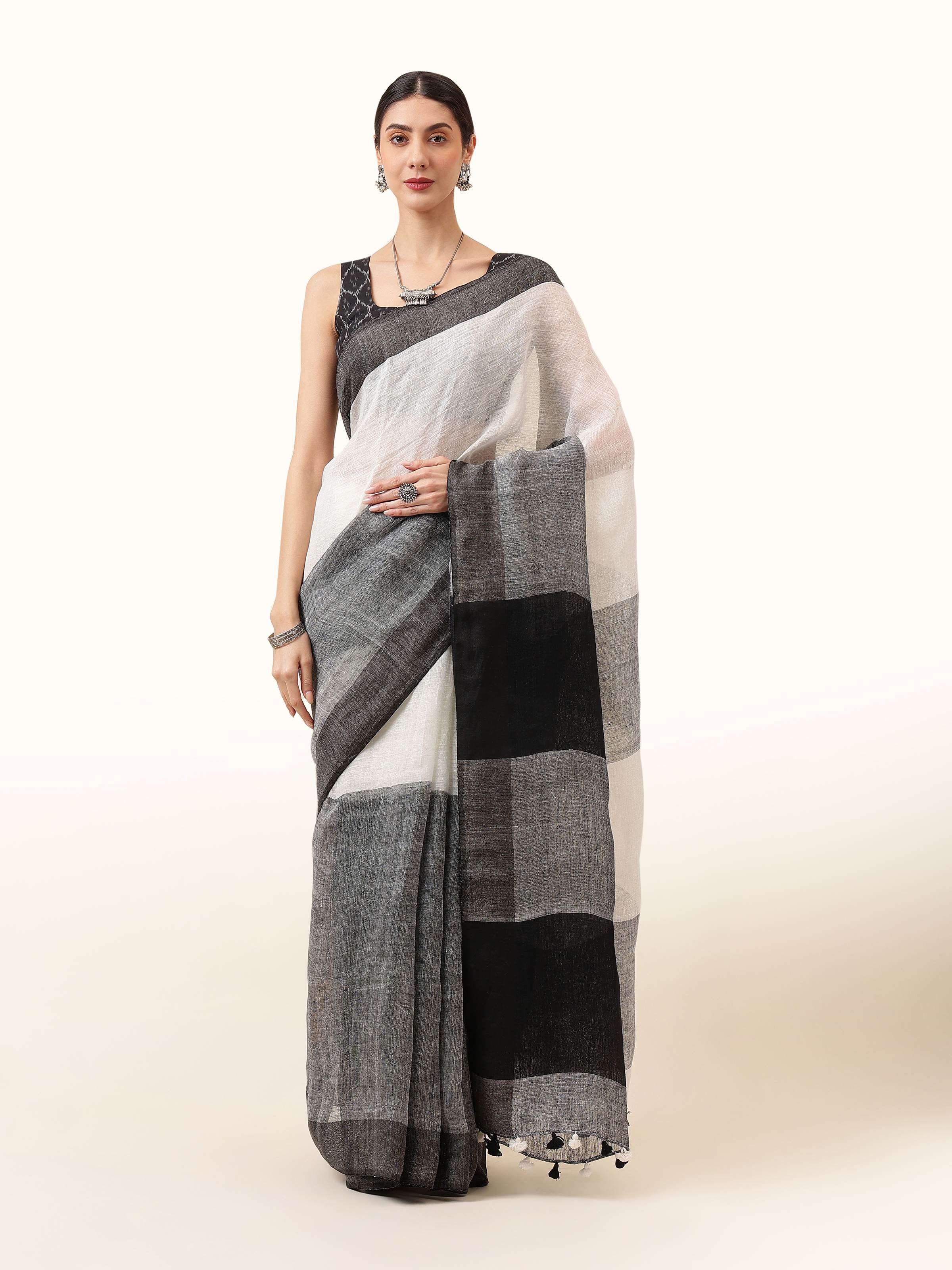 Front view of classic black linen saree with subtle sheen and minimalist appeal