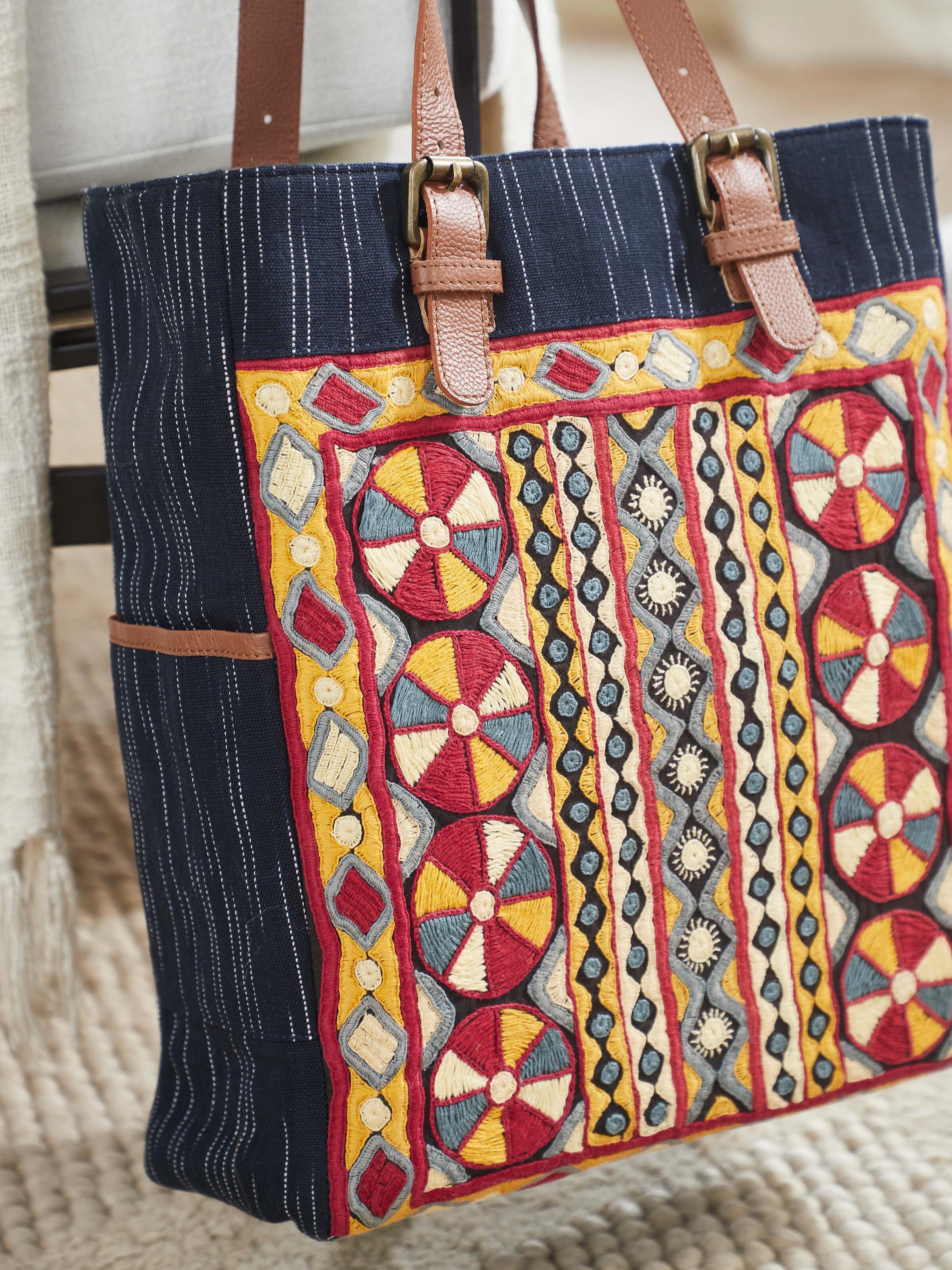 Side view of Grey Leather & Textile Embroidered Tote Bag highlighting detailed stitching and embroidery.