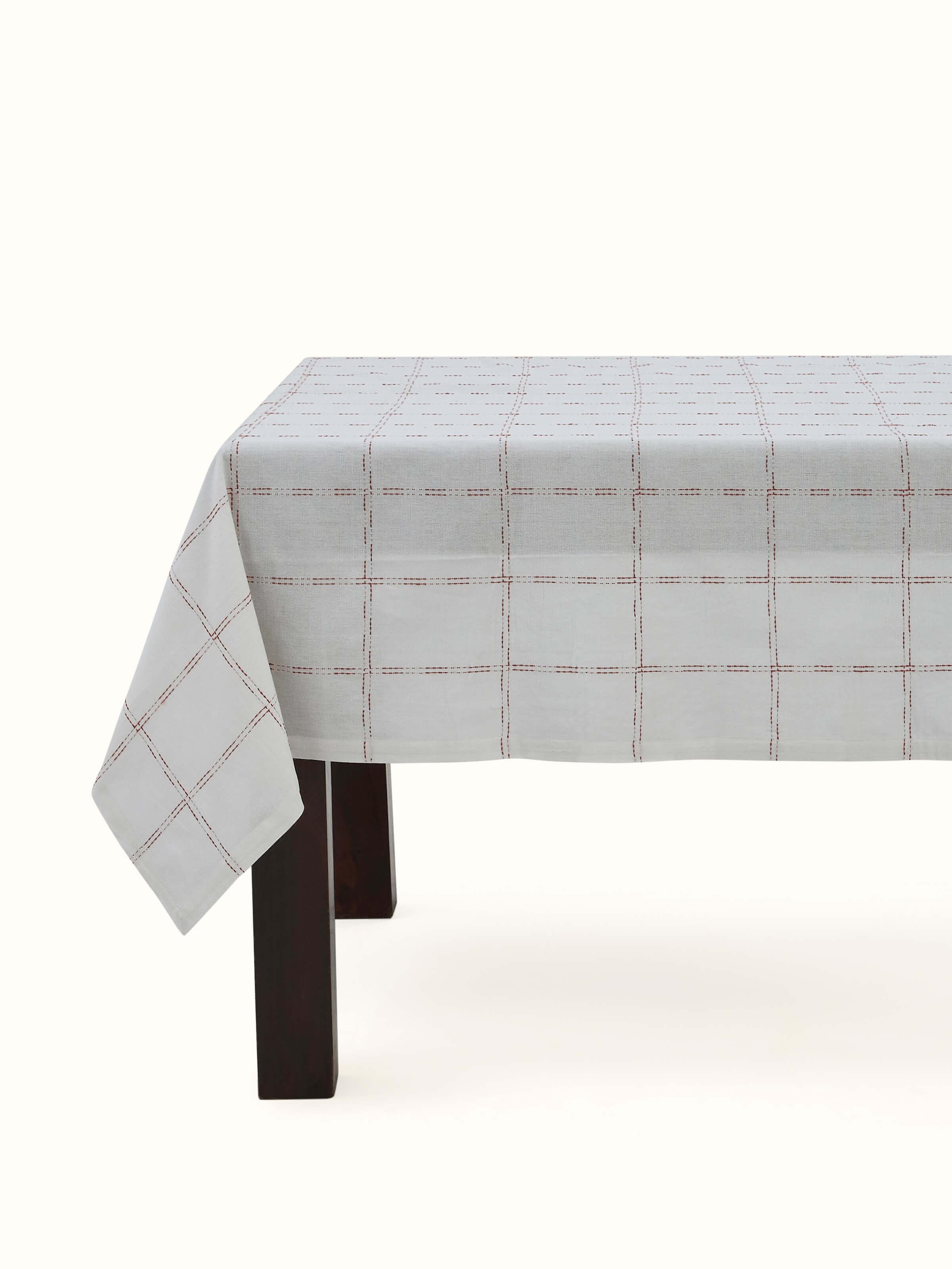 Front view showing the rust check pattern on the cotton handloom fabric, designed for 4 seater tables