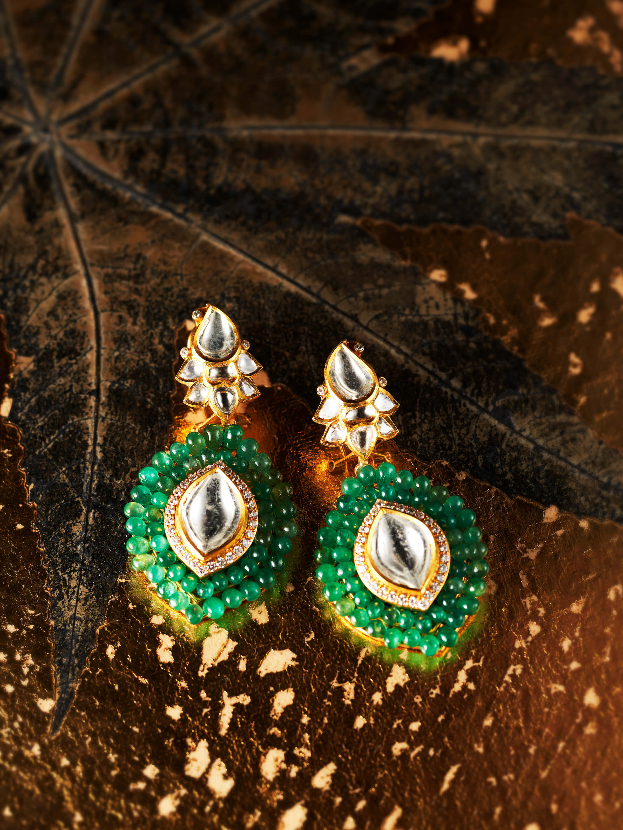 lifestyle view of dank polki 14 karat gold drop earrings