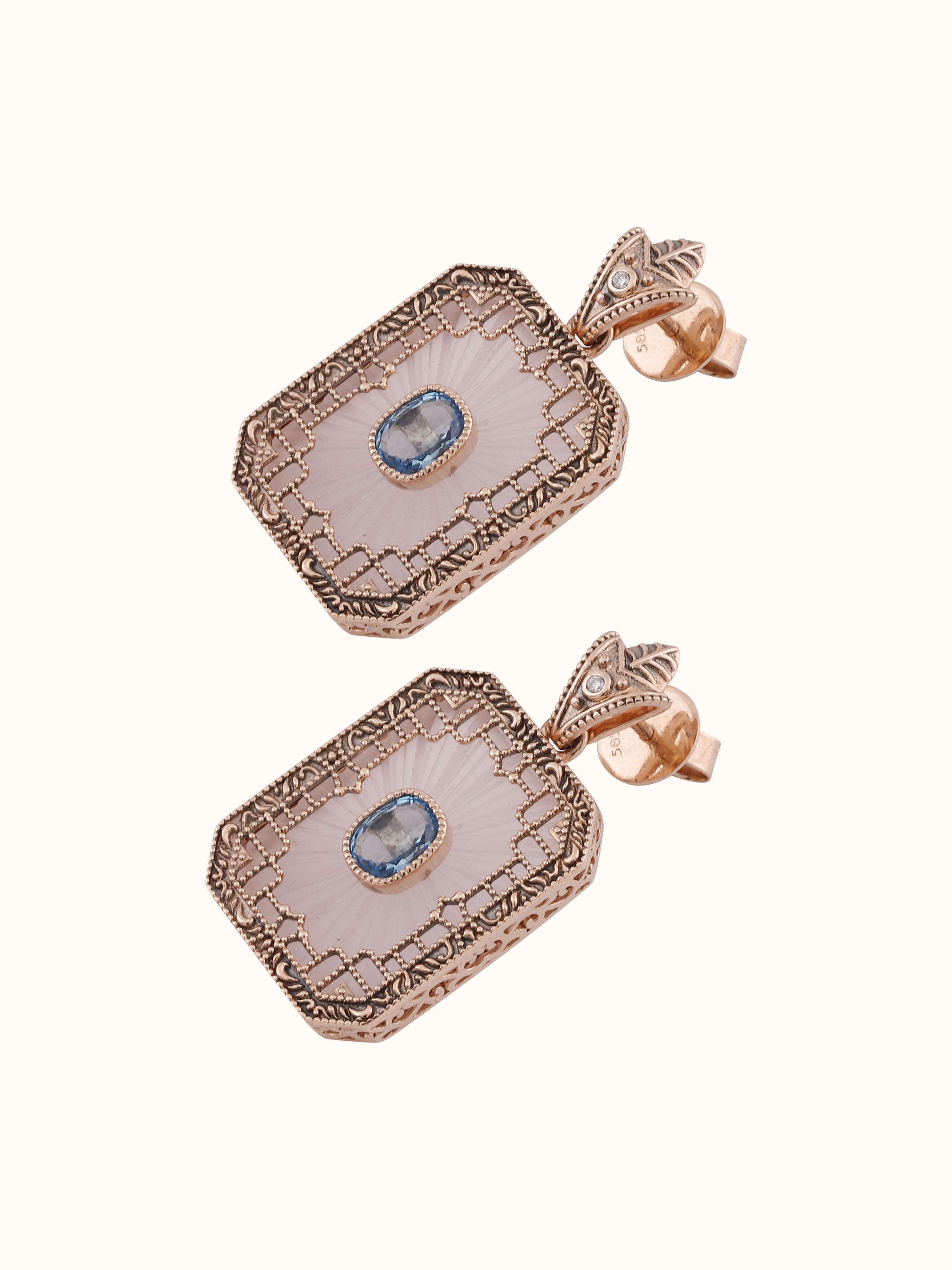 Worn view of lapidary 14 karat gold drop earrings