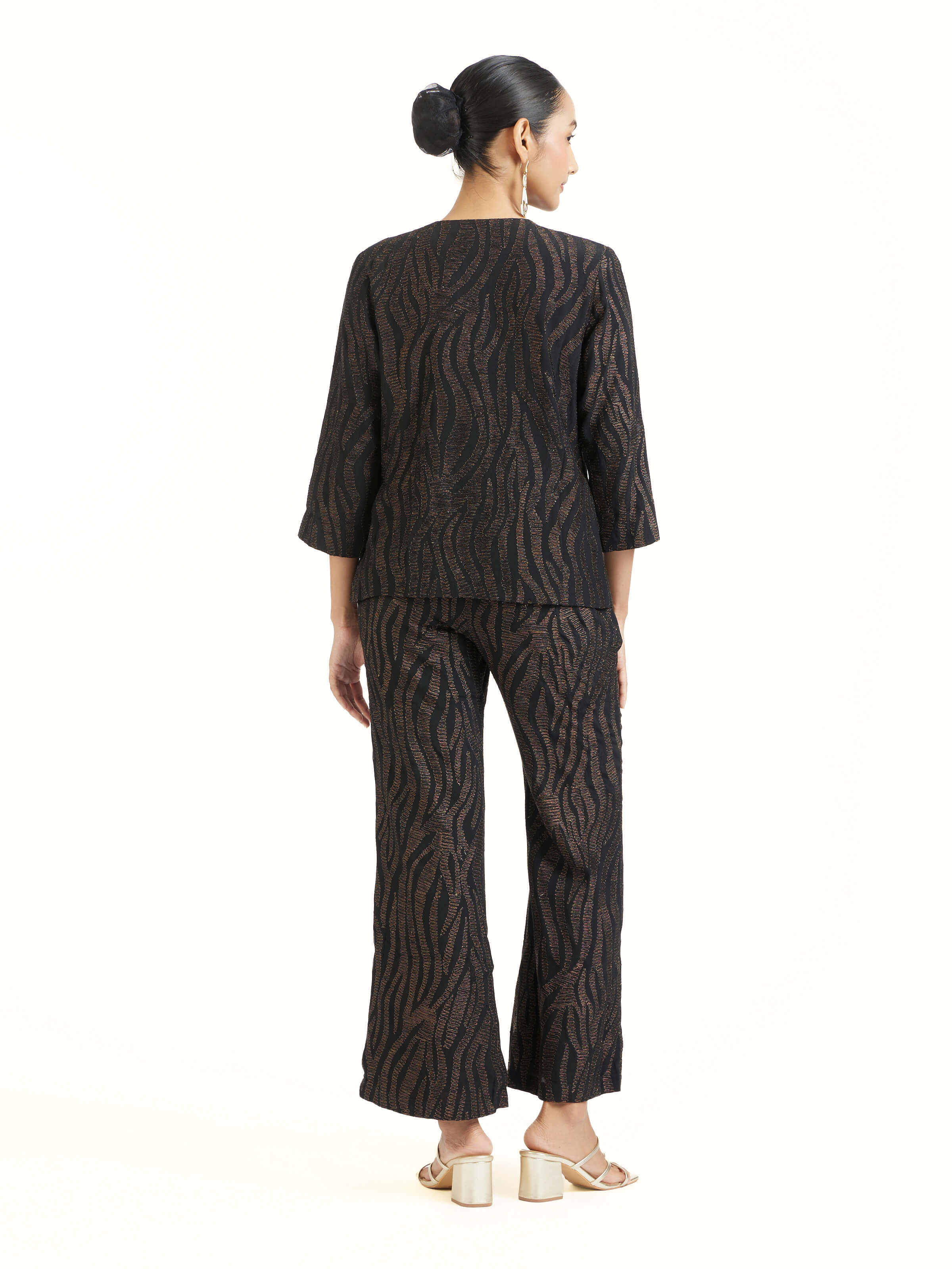 Back view of black aari hand embroidered jacket displaying complete design